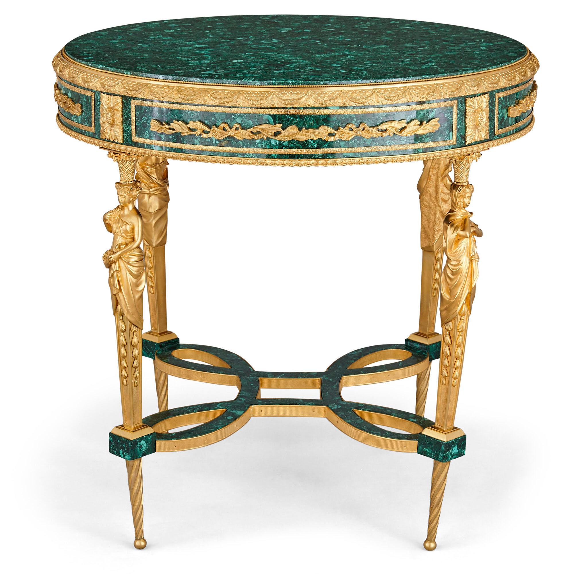 Two neoclassical Louis XVI style malachite and gilt bronze guéridons
French, 20th century
Dimensions: Height 79cm, diameter 80cm

This pair of circular side tables are crafted from ormolu and malachite, designed in the Neoclassical Louis XVI style,