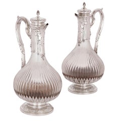 Two Neoclassical Style Silver and Crystal Claret Jugs