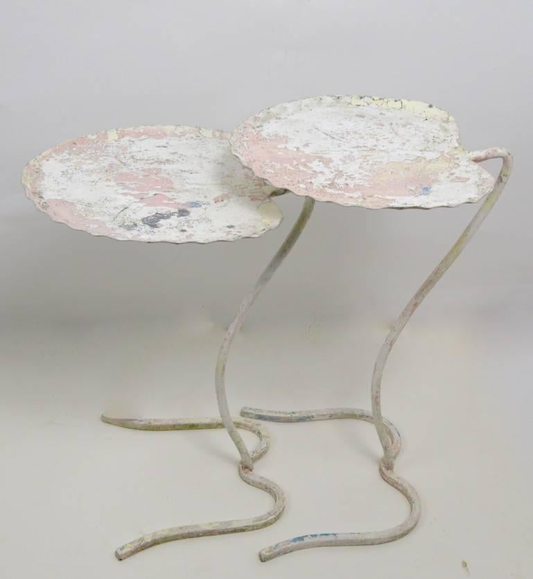 Nice old set of nesting Lilly Pad tables by Salterini. Currently in old paint finish, nice as is or we offer custom powder coating if you prefer a more polished look.