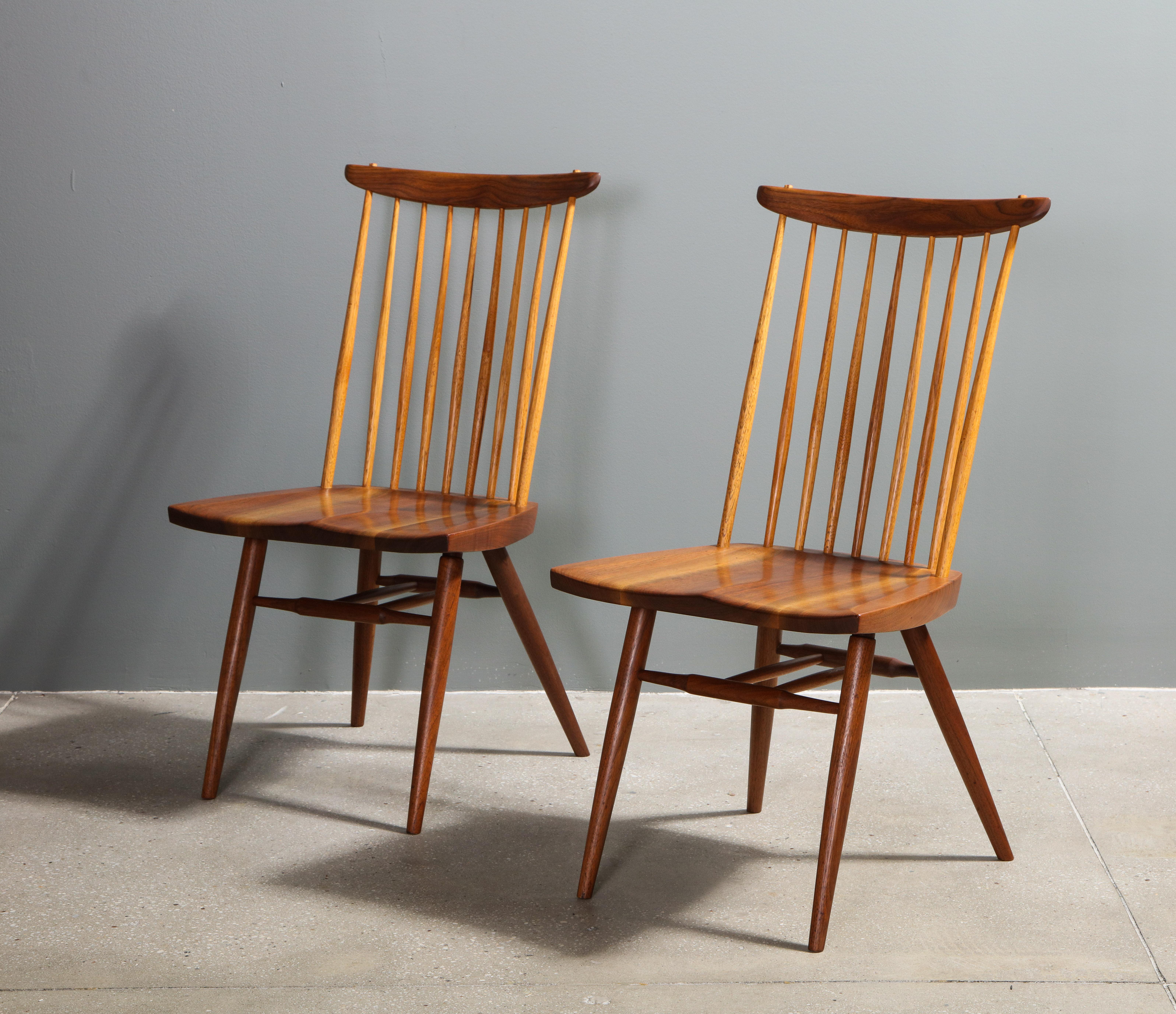 The walnut side chairs. Each with a beautifully grained seat and inscribed with client's name 
