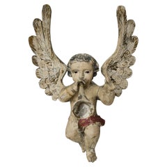 Deux anges chérubins en bois sculpté du XIXe siècle tenant des instruments de musique