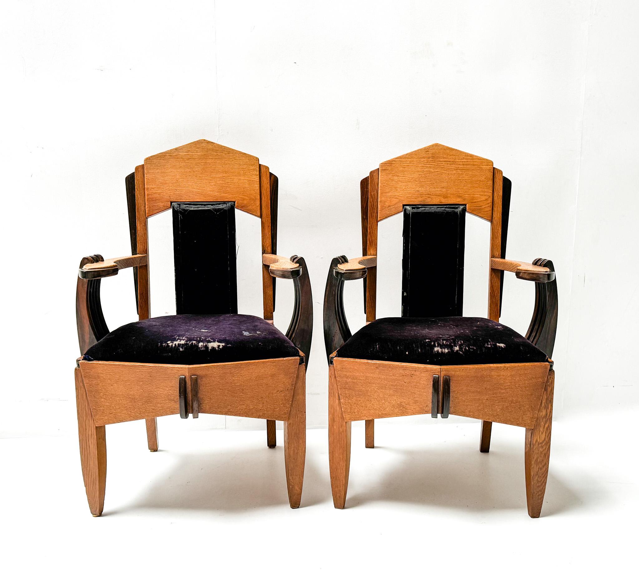 Magnificent and ultra rare pair of Art Deco Amsterdamse School armchairs.
Design by Hildo Krop.
Striking Dutch design from the 1920s.
Solid oak frames with original solid macassar ebony elements.
The two backrests and two seats still have the