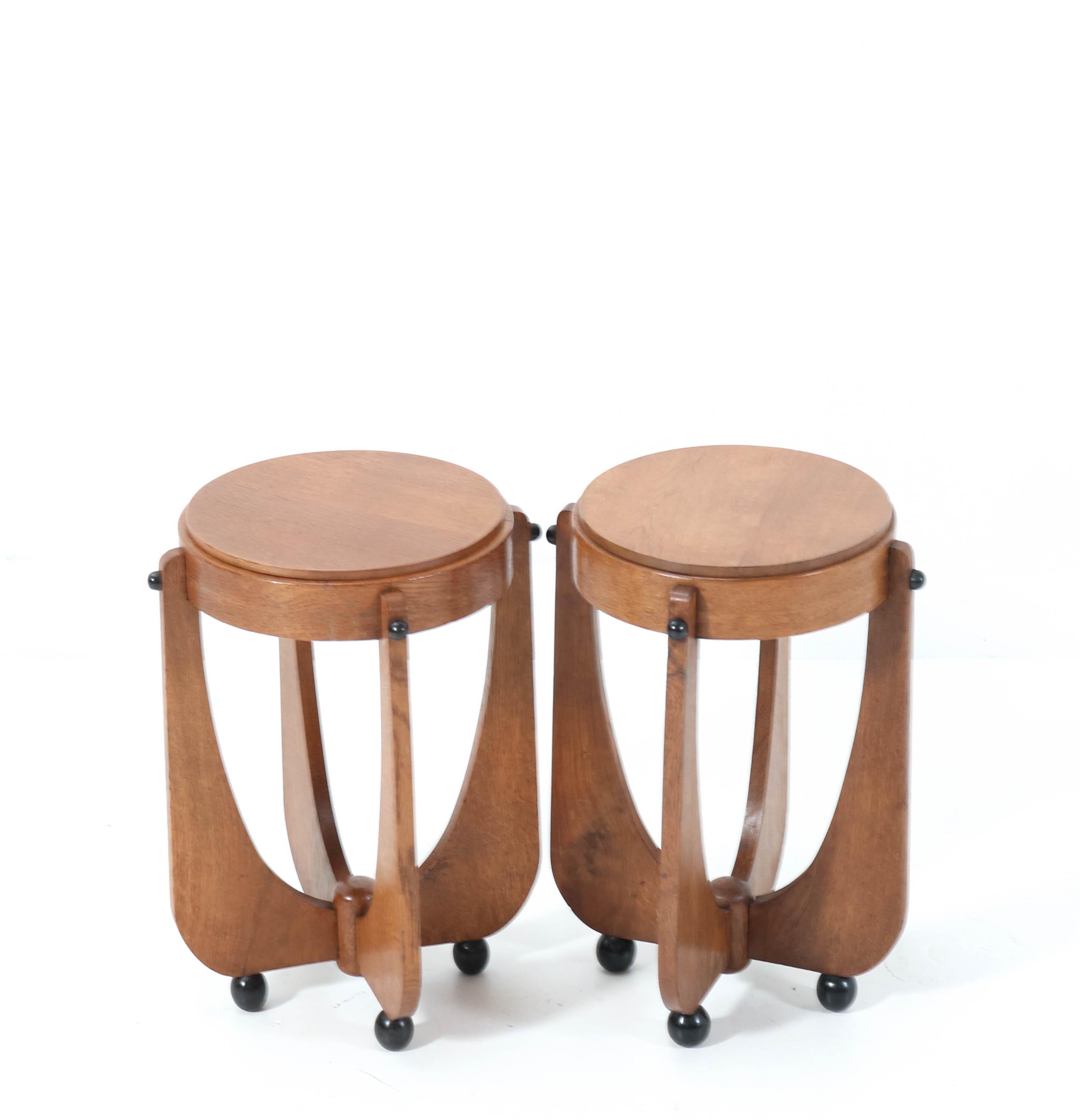 Magnificent and rare pair of Art Deco Amsterdamse School side tables.
Striking Dutch design from the 1920s.
Solid oak with original black lacquered details.
In very good condition with a beautiful patina.
Please note that there is 1 cm or 0.39