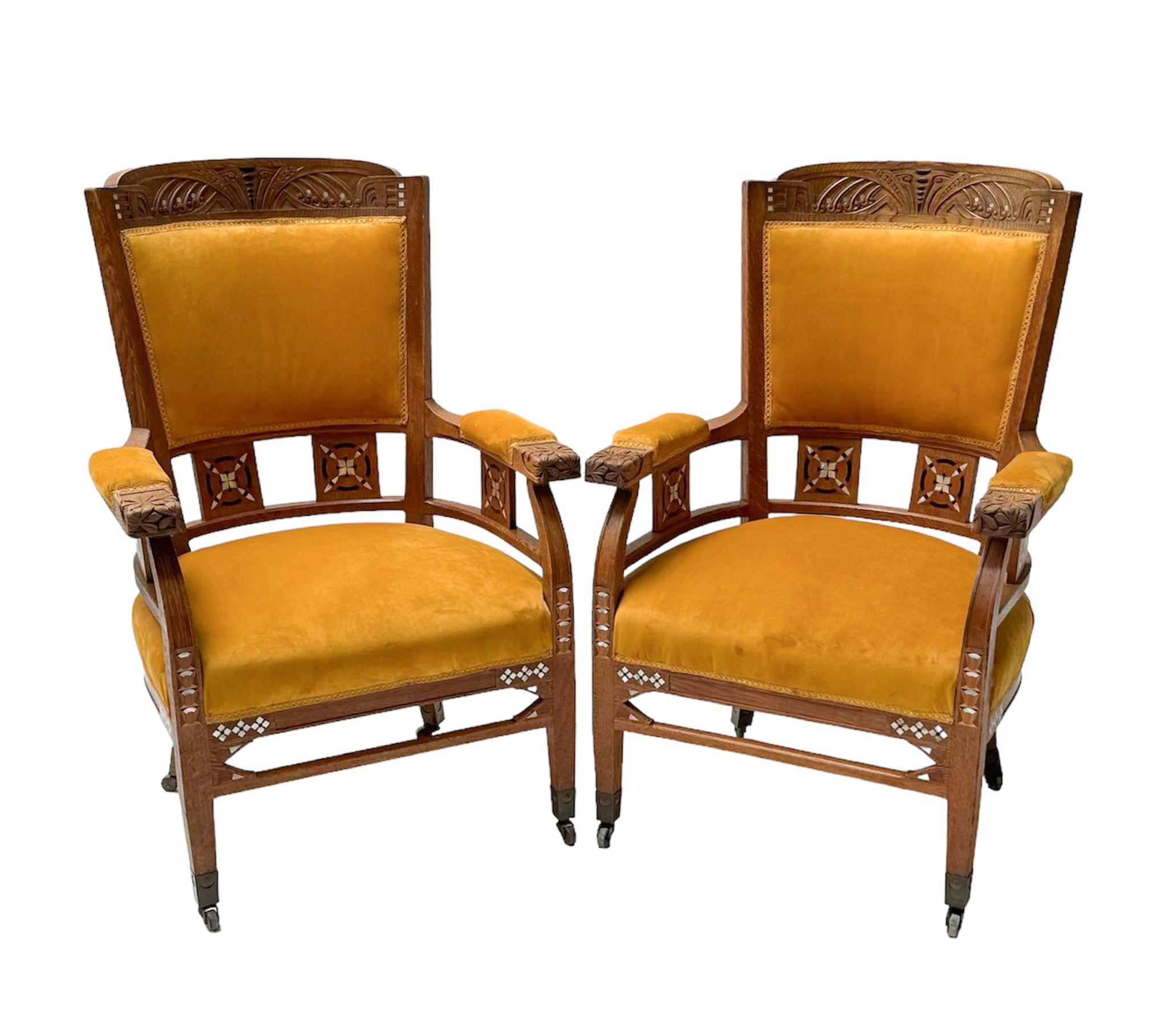 Magnificent and ultra rare pair of Art Nouveau Arts & Crafts armchairs.
Design by Royal H.F. Jansen & Zonen Amsterdam.
Striking Dutch design from the 1900s.
Solid oak frames with original hand-carved elements and inlay.
Re-upholstered with velvet