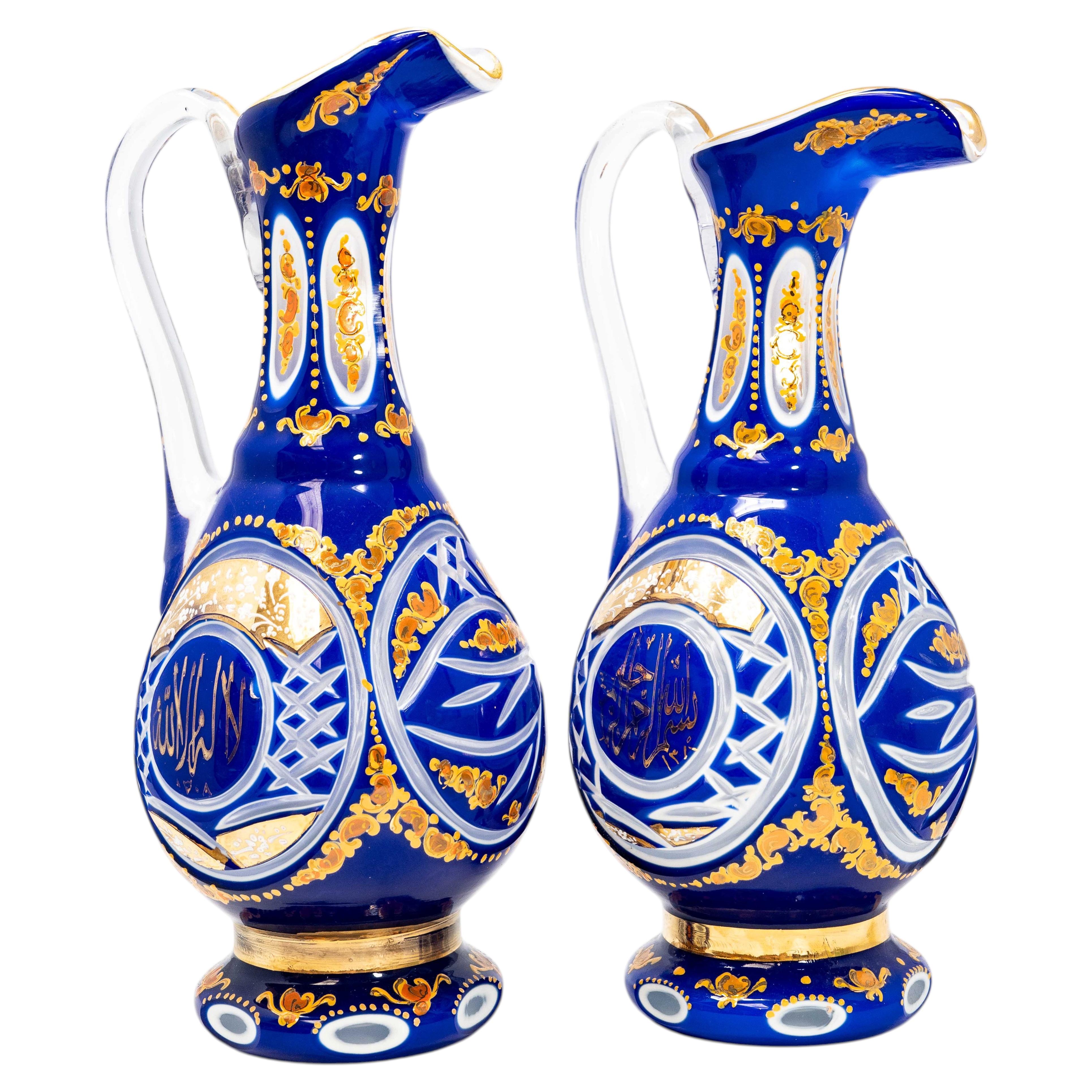 Two of Bohemian Jars Cobalt Overlay Glass Ewers with Arabic Calligraphy