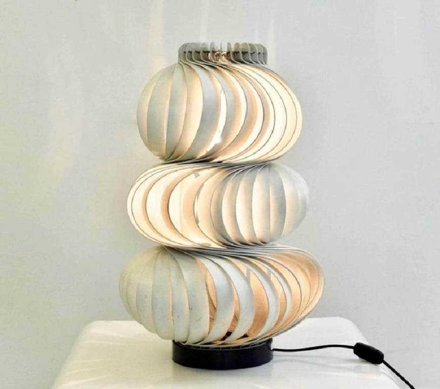 Olaf von Bohr, Austrian designer born in 1927.

'Medusa', lamps, model created in 1968.
Composed of curved strips of white lacquered aluminium arranged in spiral and a black lacquered circular base.