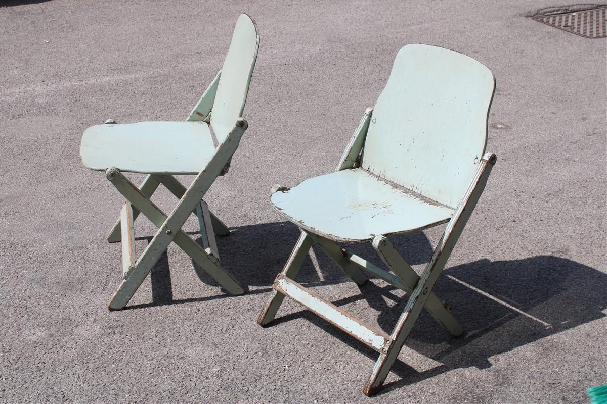 Two old folding chairs in bentwood Italy 1950s curved wood.