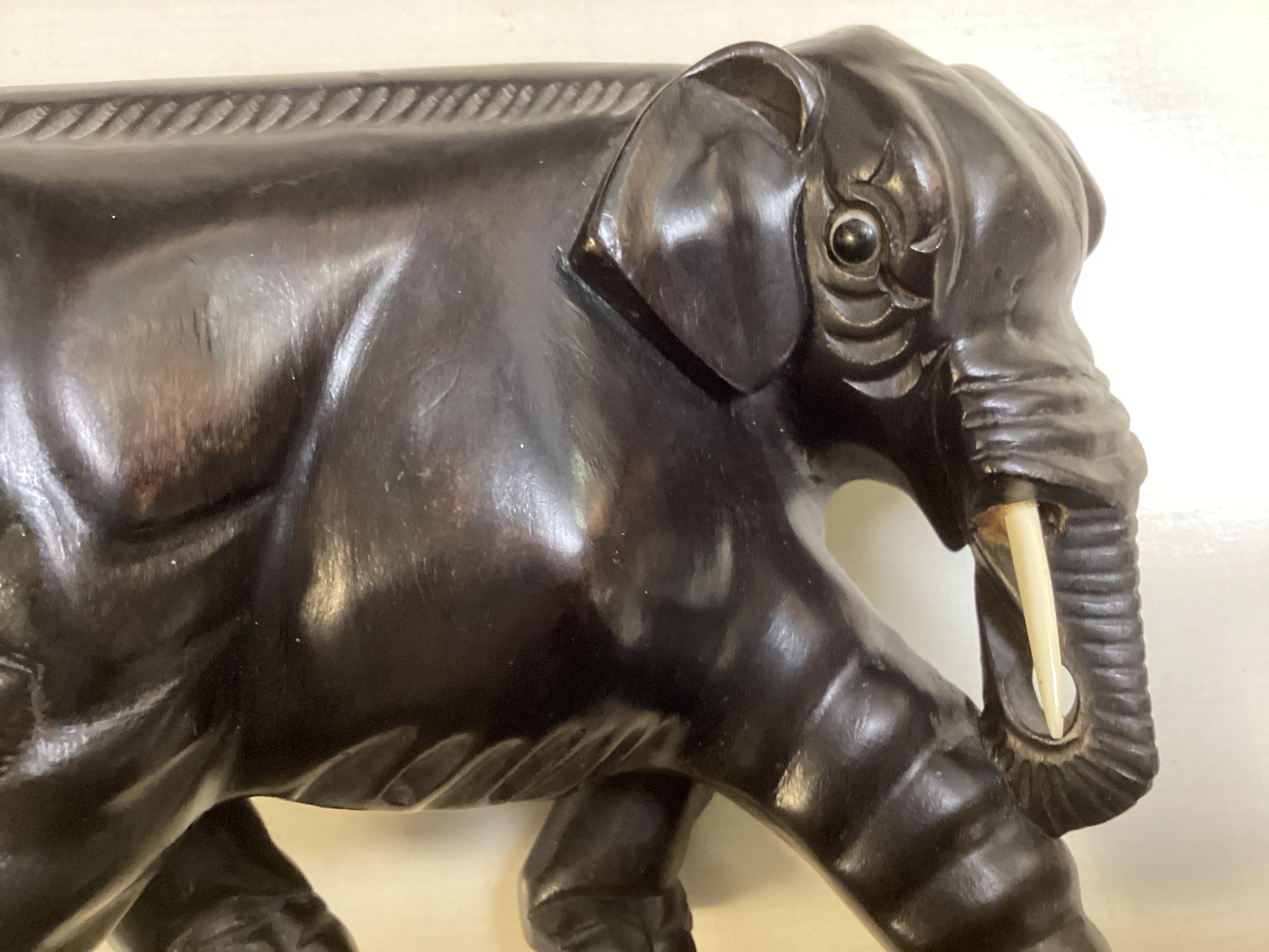 Two Opposing Ebonized Elephant Figures With Stands For Sale 5