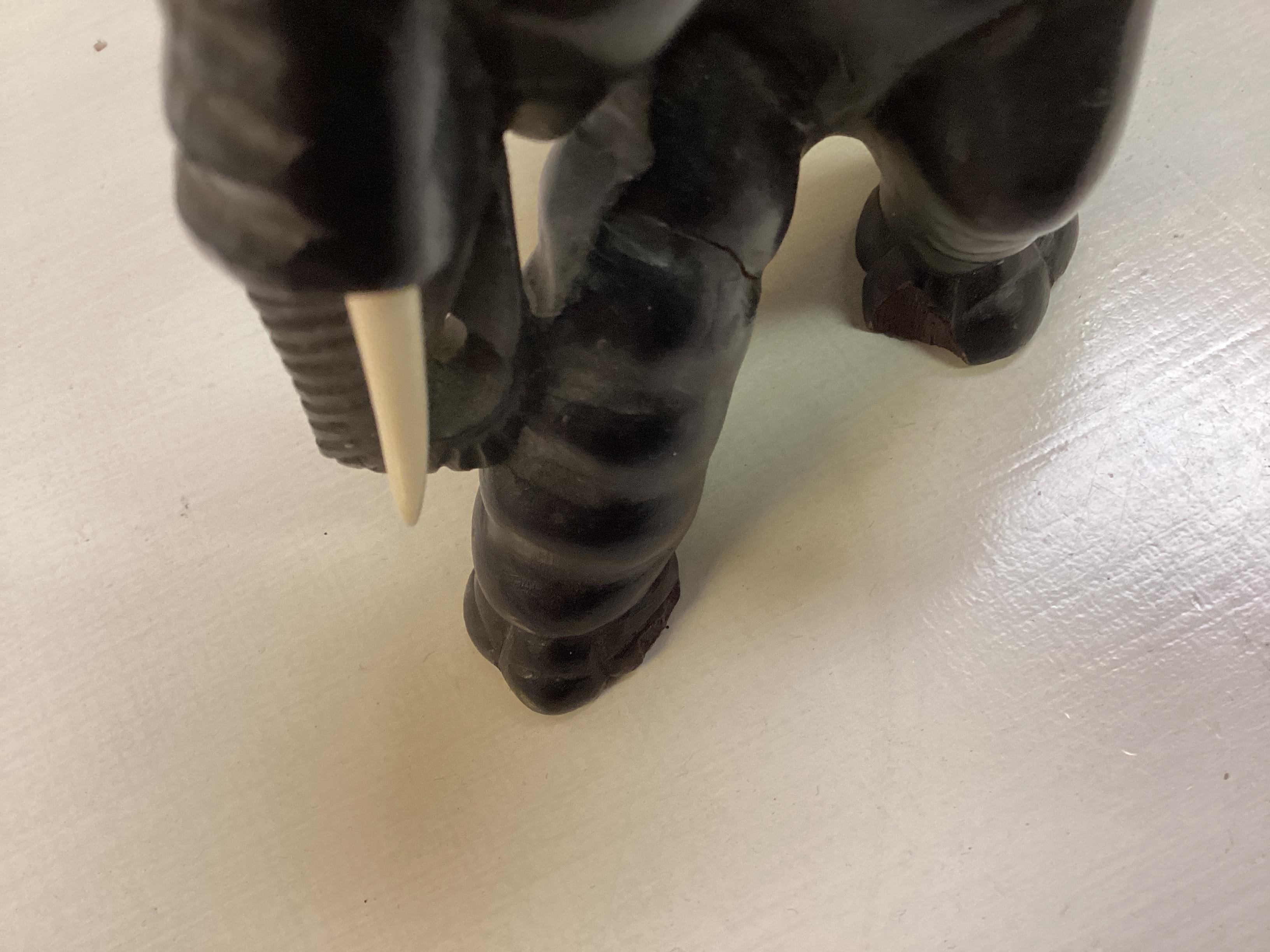 Two Opposing Ebonized Elephant Figures With Stands For Sale 6