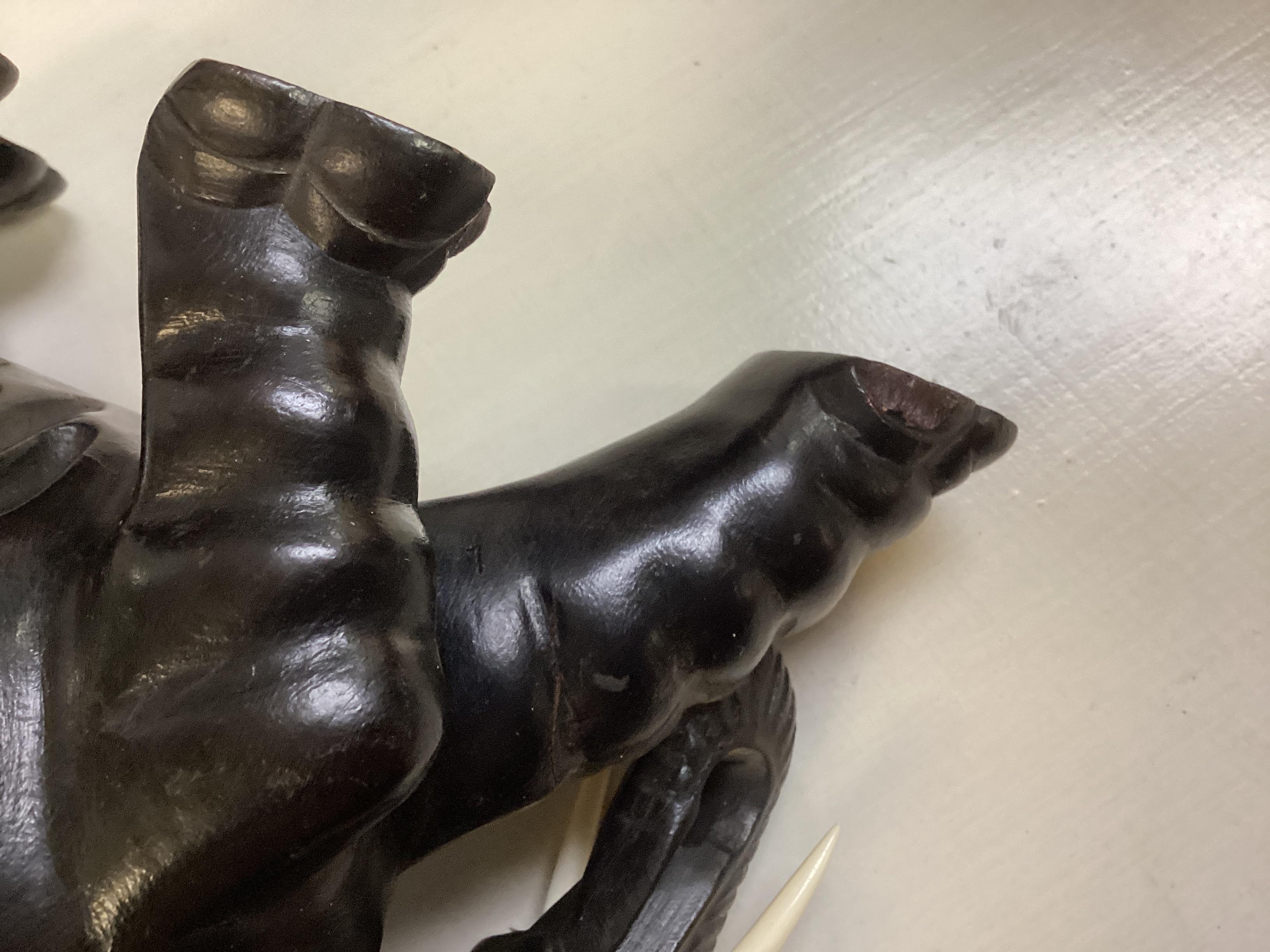Two Opposing Ebonized Elephant Figures With Stands For Sale 7