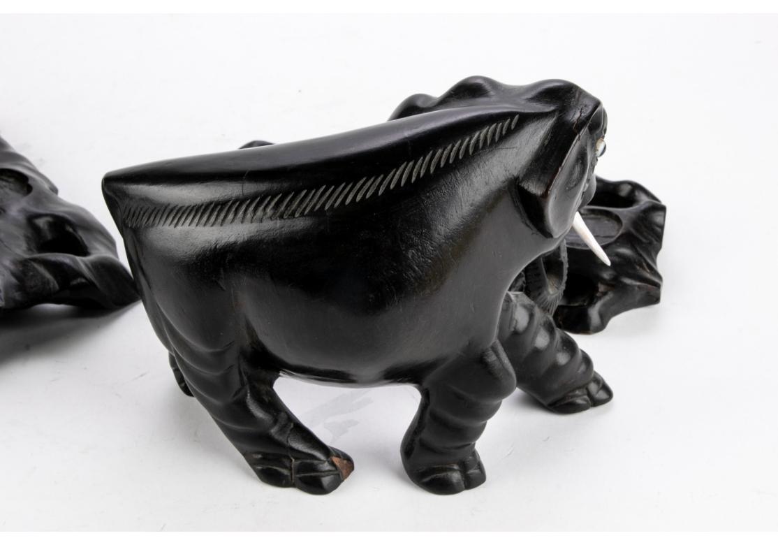 20th Century Two Opposing Ebonized Elephant Figures With Stands For Sale
