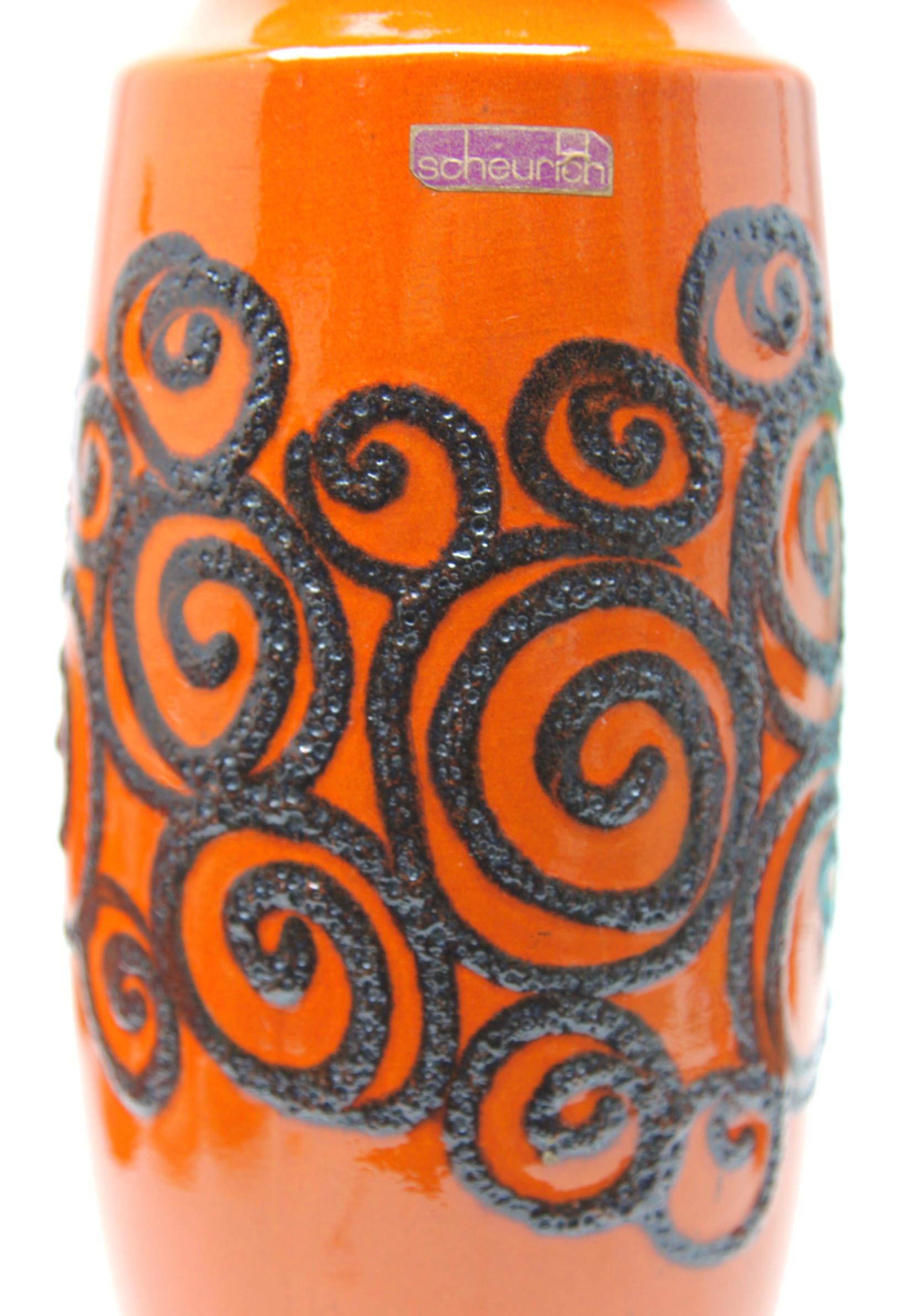 Fat lava vase, vintage Scheurich W-Germany 239-41, dates from 1968, with a satin gloss glaze in 'tango' orange.

With impressed number on base. 239-41, W-Germany.
High relief trail glaze with tribalist /primitivist inspiration.

The piece is in