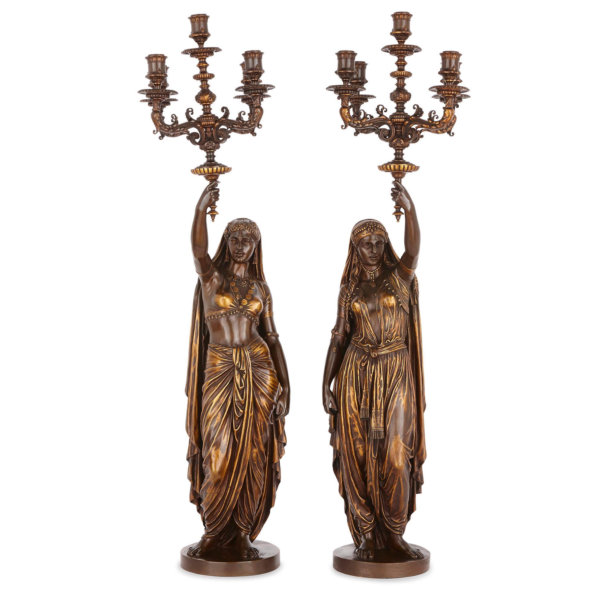 Émile Coriolan Hippolyte Guillemin, the famous French sculptor, designed these exquisite bronze figural torchères in circa 1880. Guillemin was an accomplished artist, who regularly exhibited at the Salon in Paris from the 1870s-1890s. Indeed,