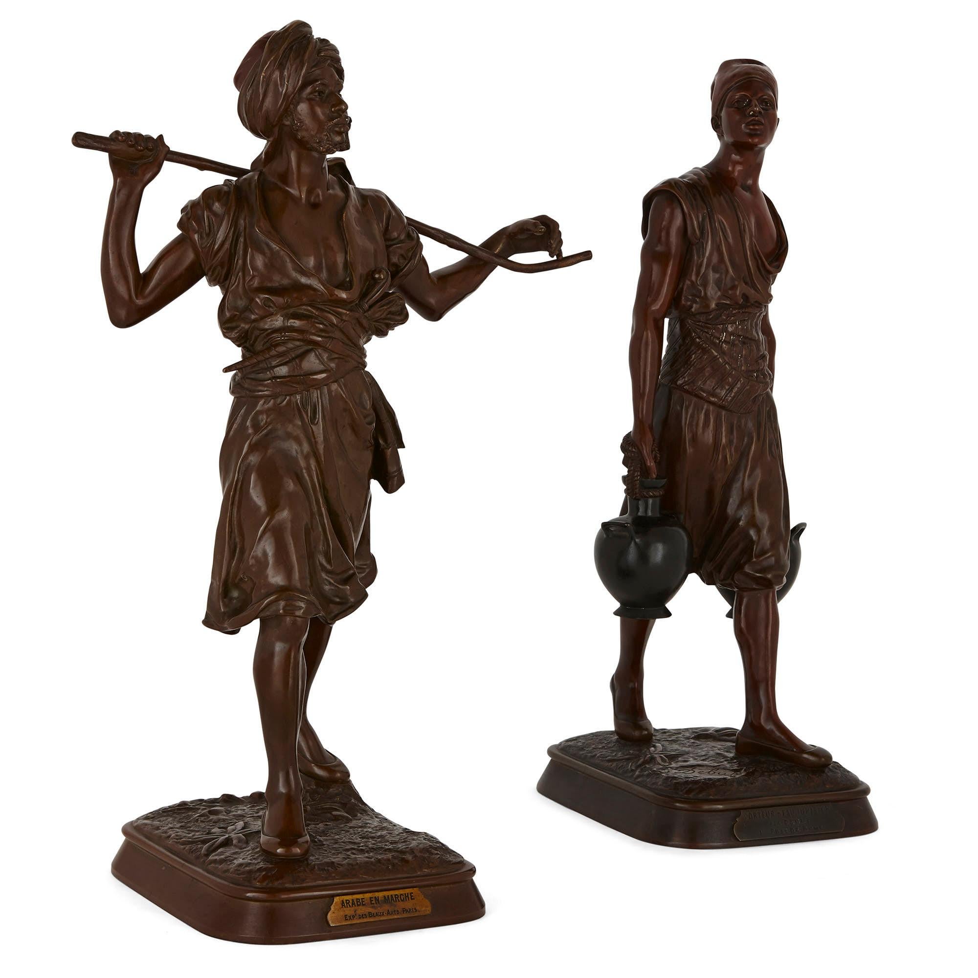 These exceptional patinated bronze statues depict ‘Arabe en Marche’ (Arab on the move) and Porteau d’Eau Tunisien (Tunisian water carrier). The former was created by the sculptor Emile Pinedo and the latter by Marcel Début. These artists were