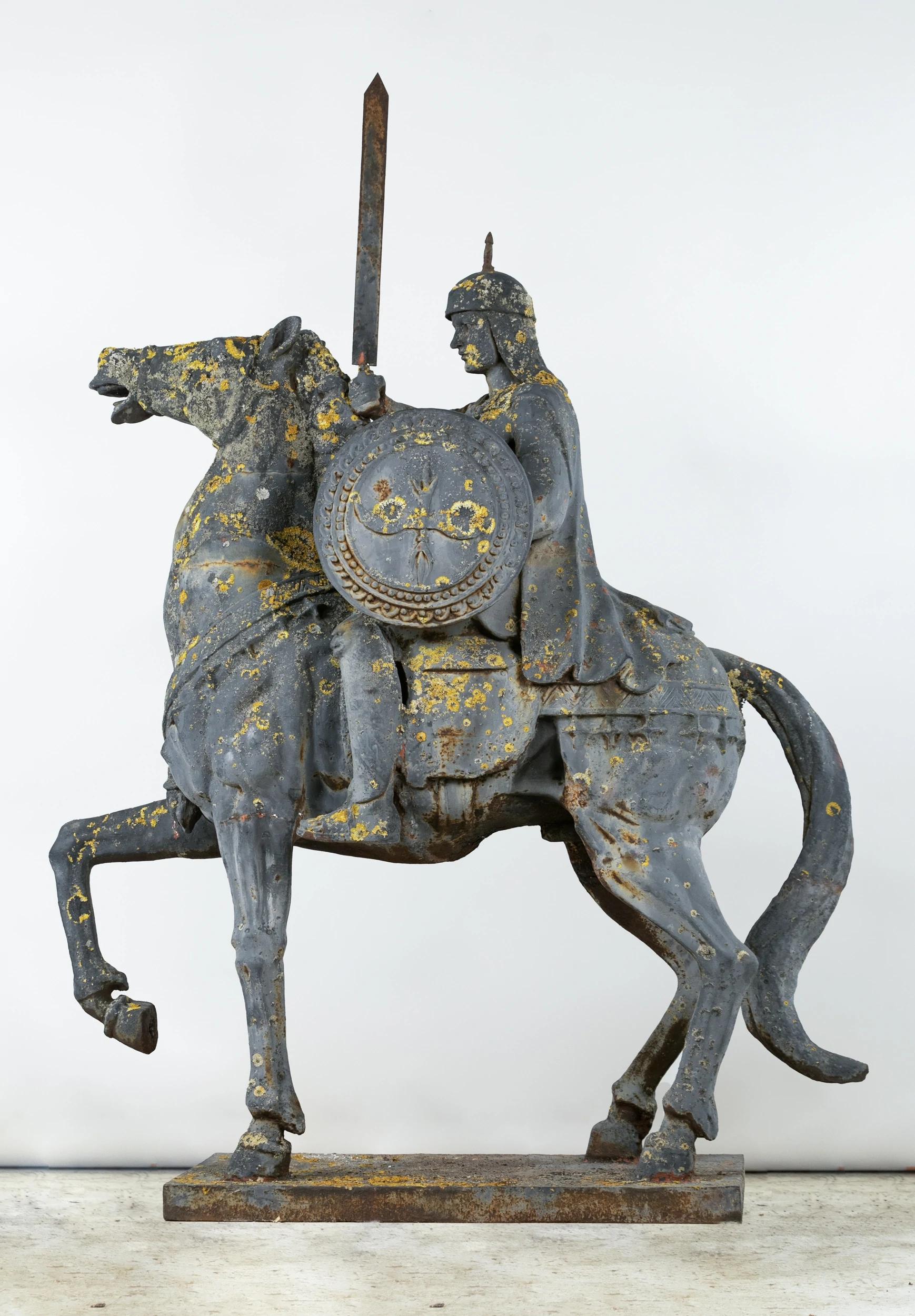 Two Ottoman horsemen, large cast-iron matching garden statues.