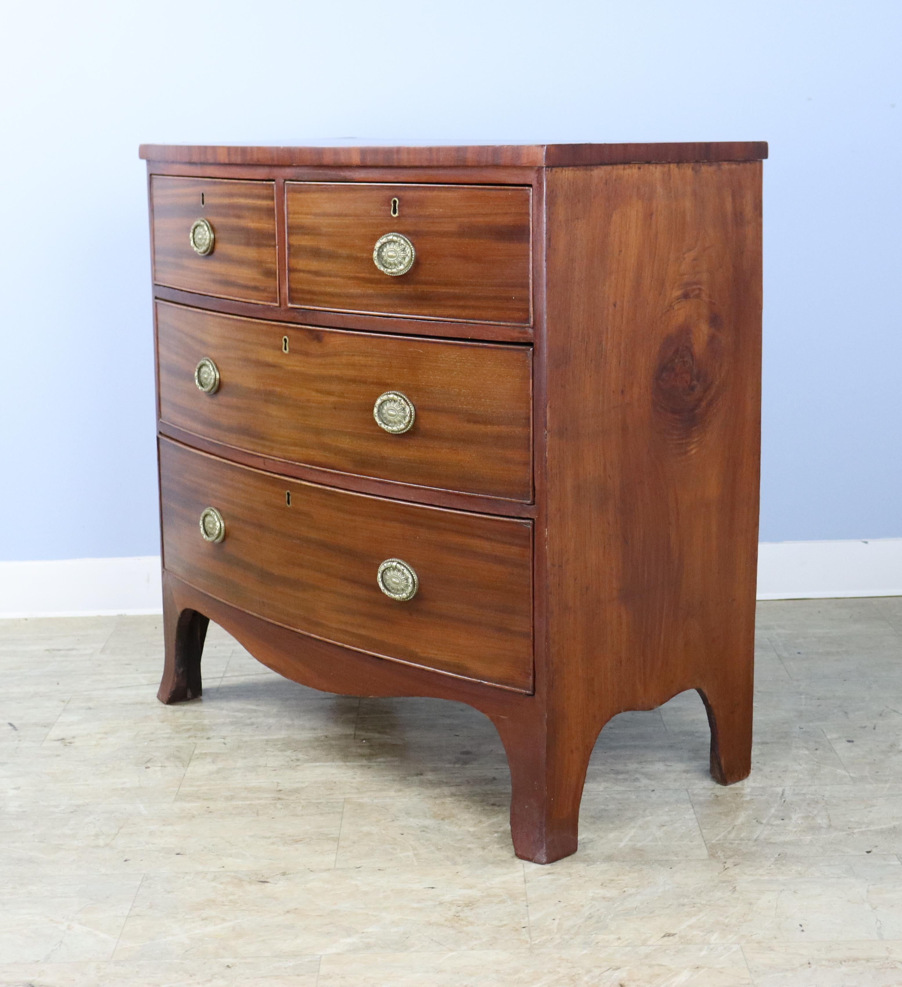 Two-over-two Mahogany Bowfront Chest with Original Feet and Brasses In Good Condition For Sale In Port Chester, NY