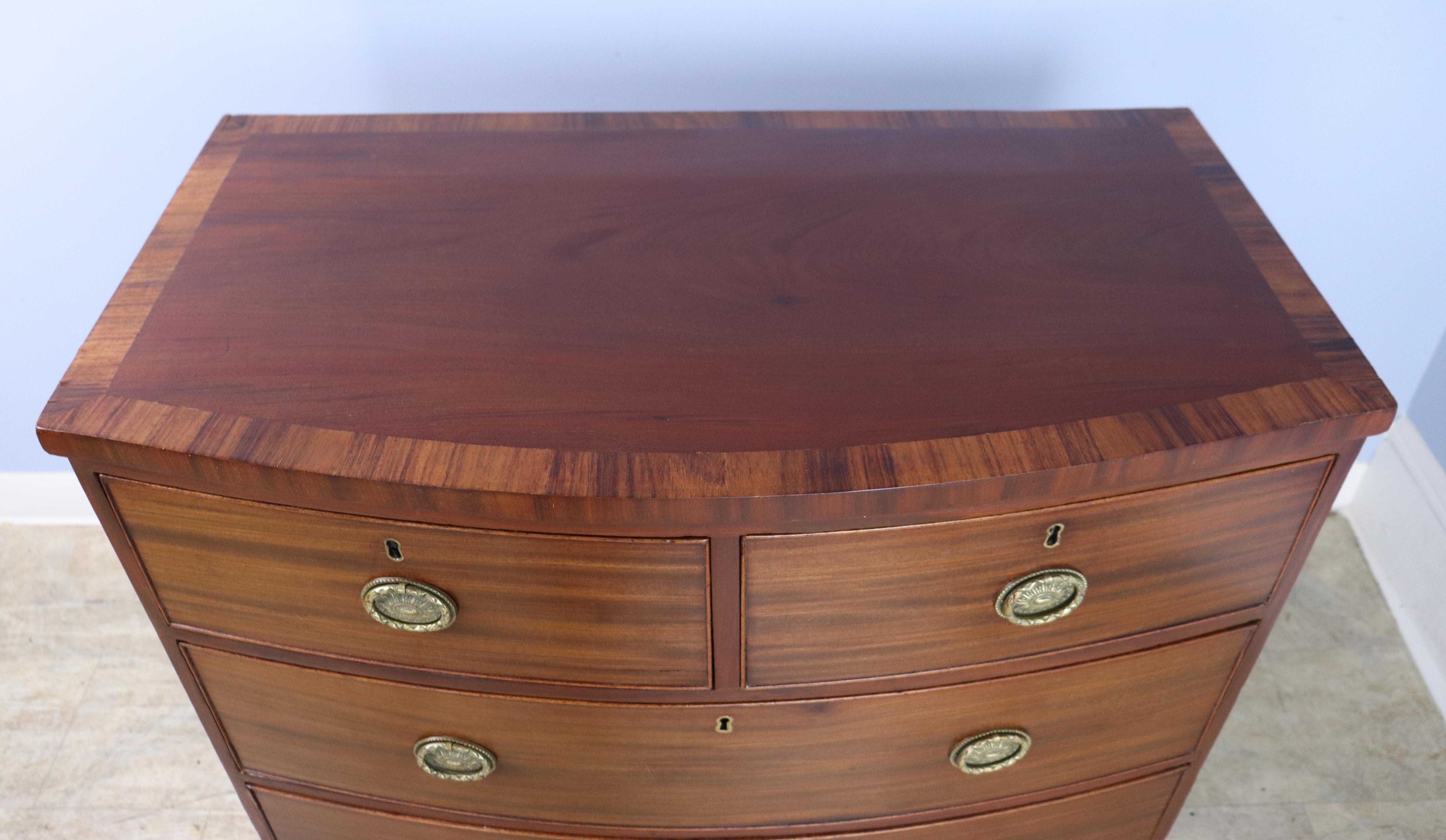 Two-over-two Mahogany Bowfront Chest with Original Feet and Brasses For Sale 3