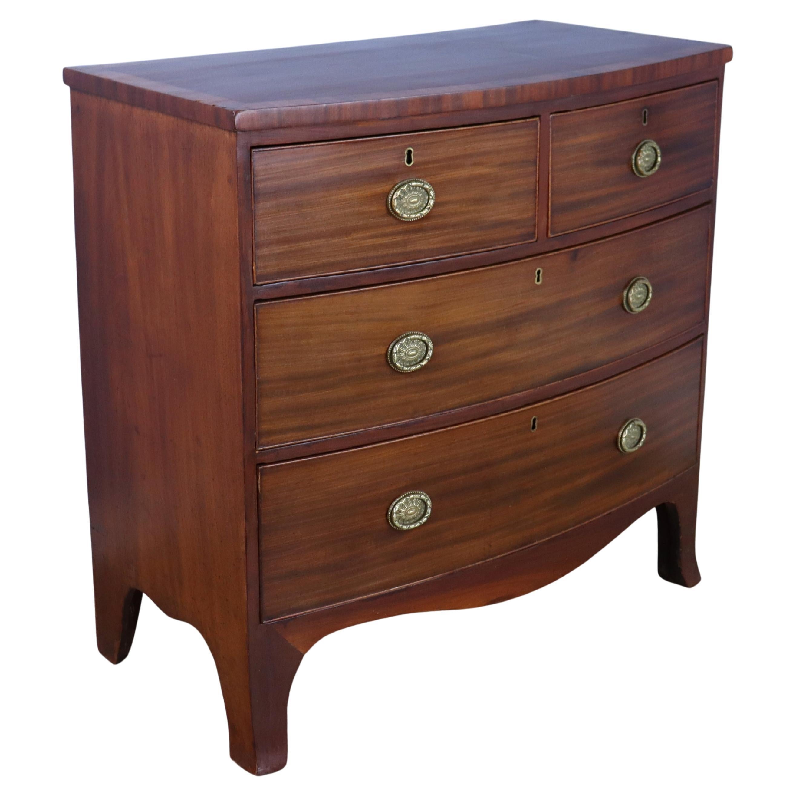Two-over-two Mahogany Bowfront Chest with Original Feet and Brasses For Sale