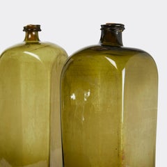Two Oversized Olive Glass Case Gin Bottles