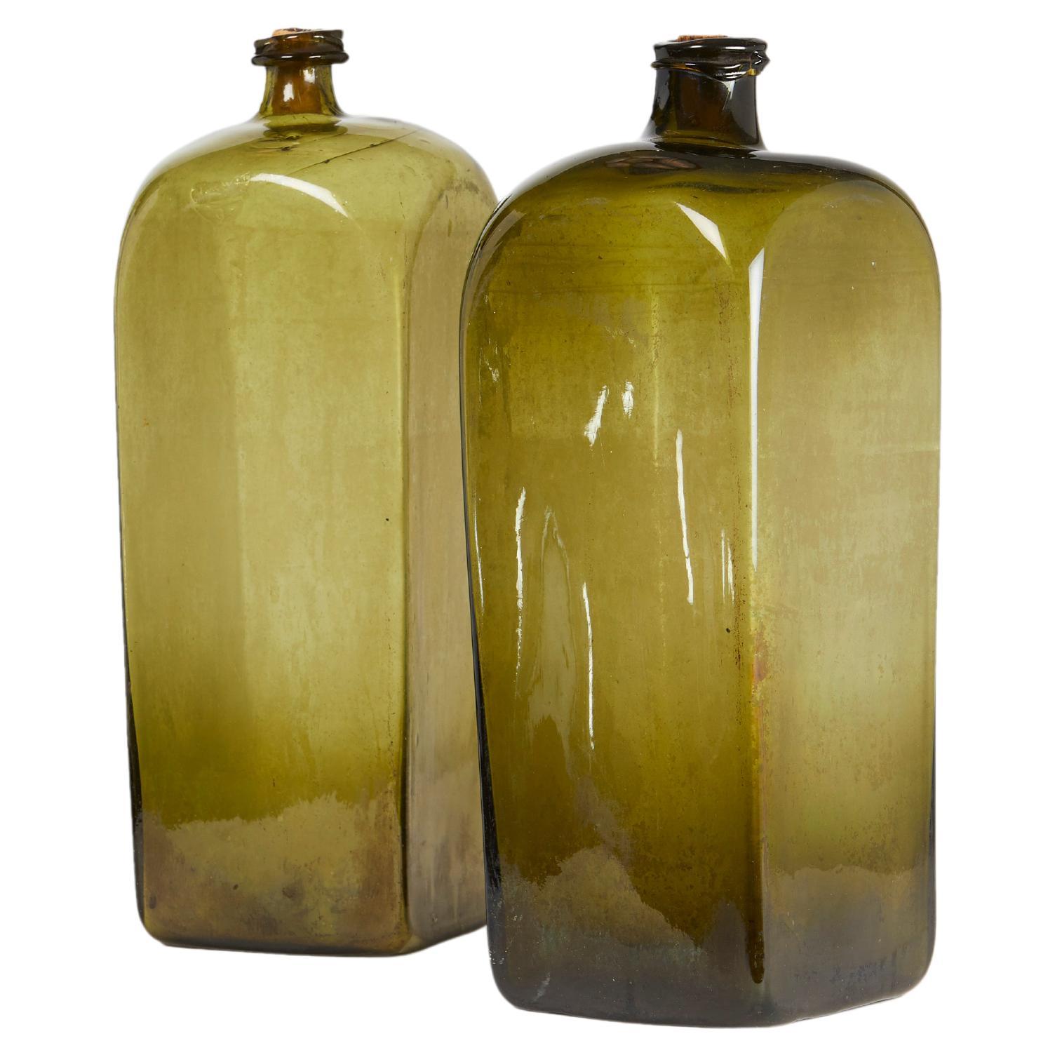 Two Oversized Olive Glass Case Gin Bottles For Sale