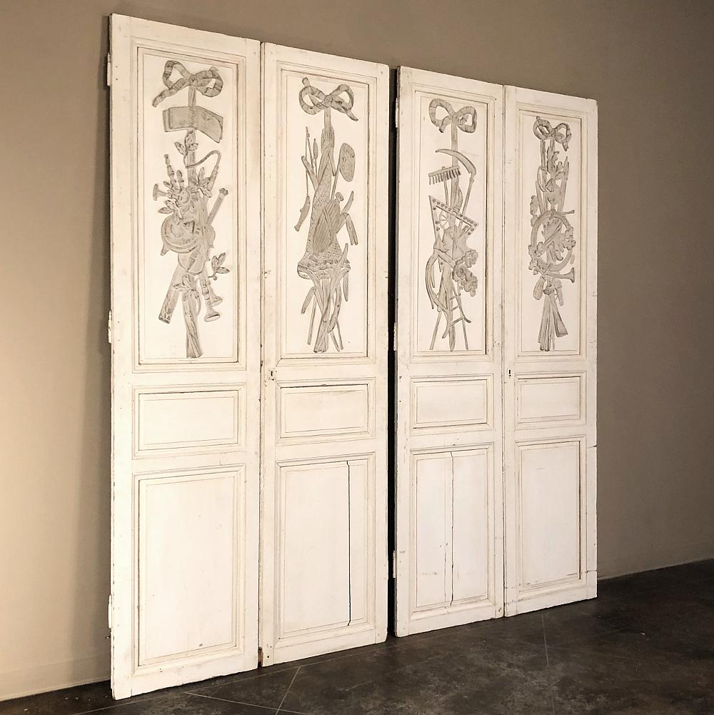Two pair 19th century French Louis XVI painted interior doors are a remarkable find, indeed! The set was designed as two distinct pairs, with each pair having a distinct left & right door, and a total of four distinct relief works, one on each door!