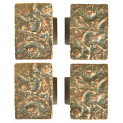 Deux poignées de porte push & pull brutalistes en bronze avec relief abstrait
