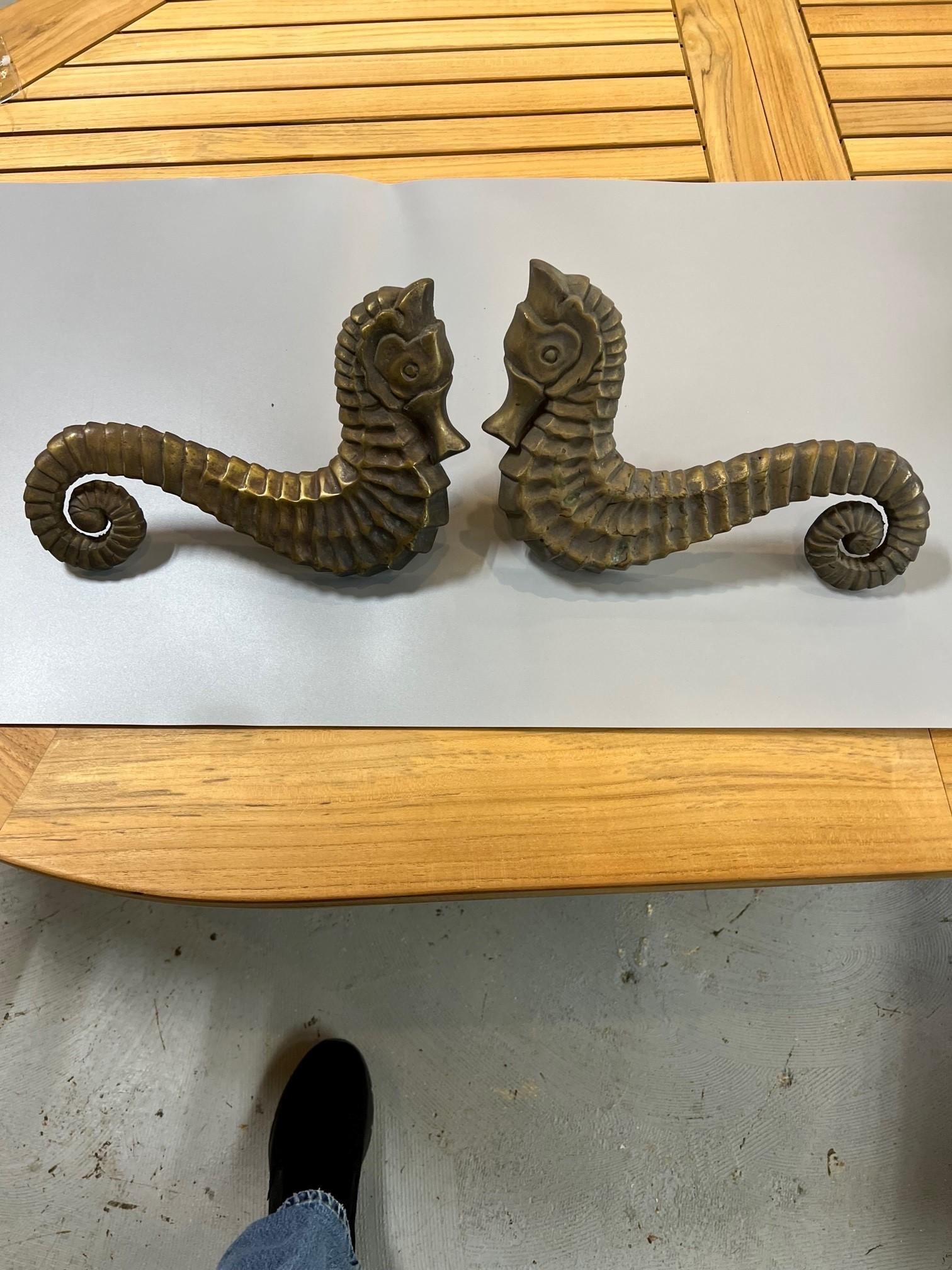 Two pairs of magnificent antique bronze seahorse door handles. They would look great in a restaurant or a home on the shore. Salvaged from an Upstate New York estate, a good find that would look beautiful on a large pair of wooden doors. They have a