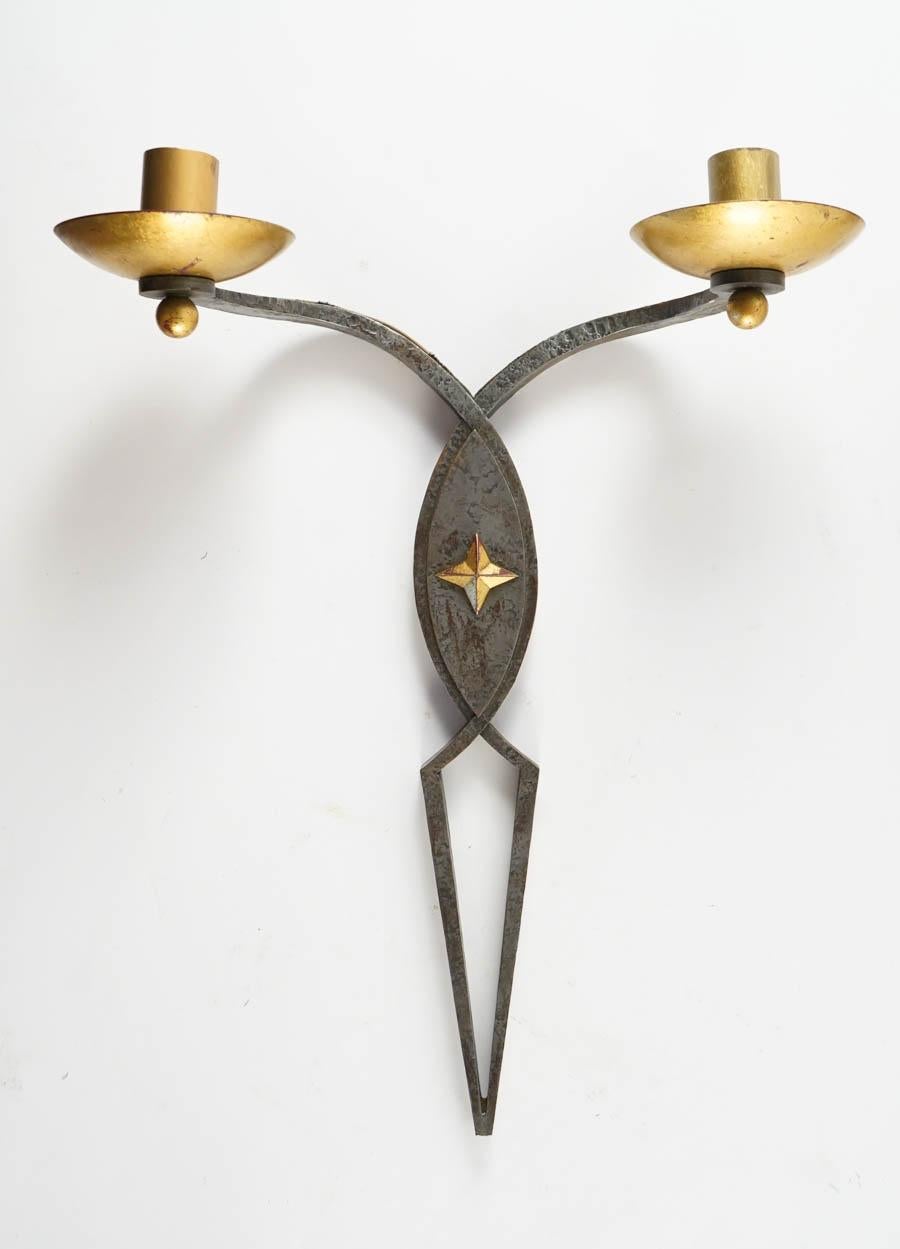 Rare set of four 1940s wall lights, in the taste of Poillerat, France
wrought iron. Can be divided in 2 pairs.