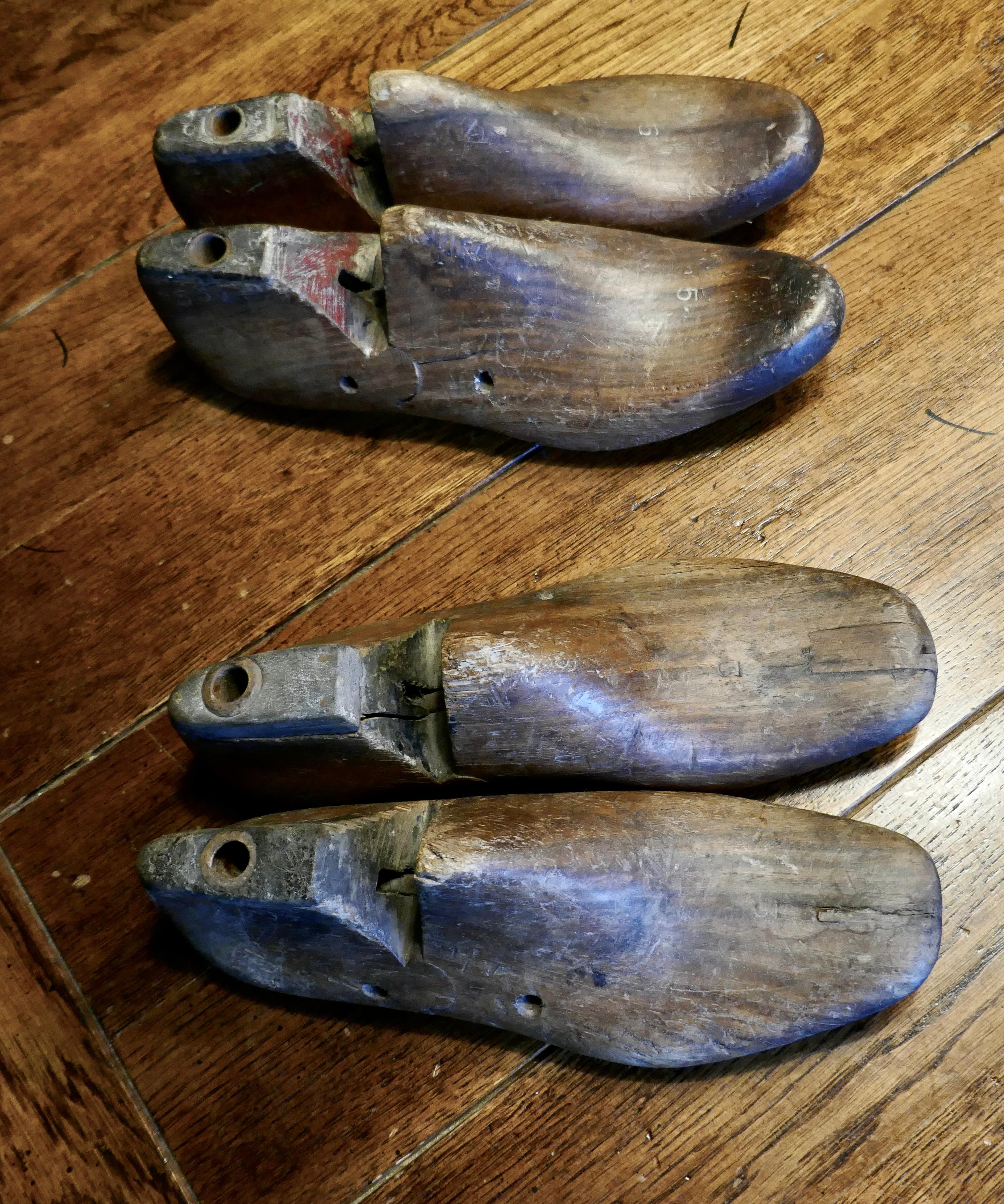 Two Pairs of 19th century Decorative Rustic antique shoe lasts. 

2 pairs of Wooden shoemaker's lasts, the lasts have hand made iron soles and are numbered 3 and 5 they have wonderful rustic character 

NV292.