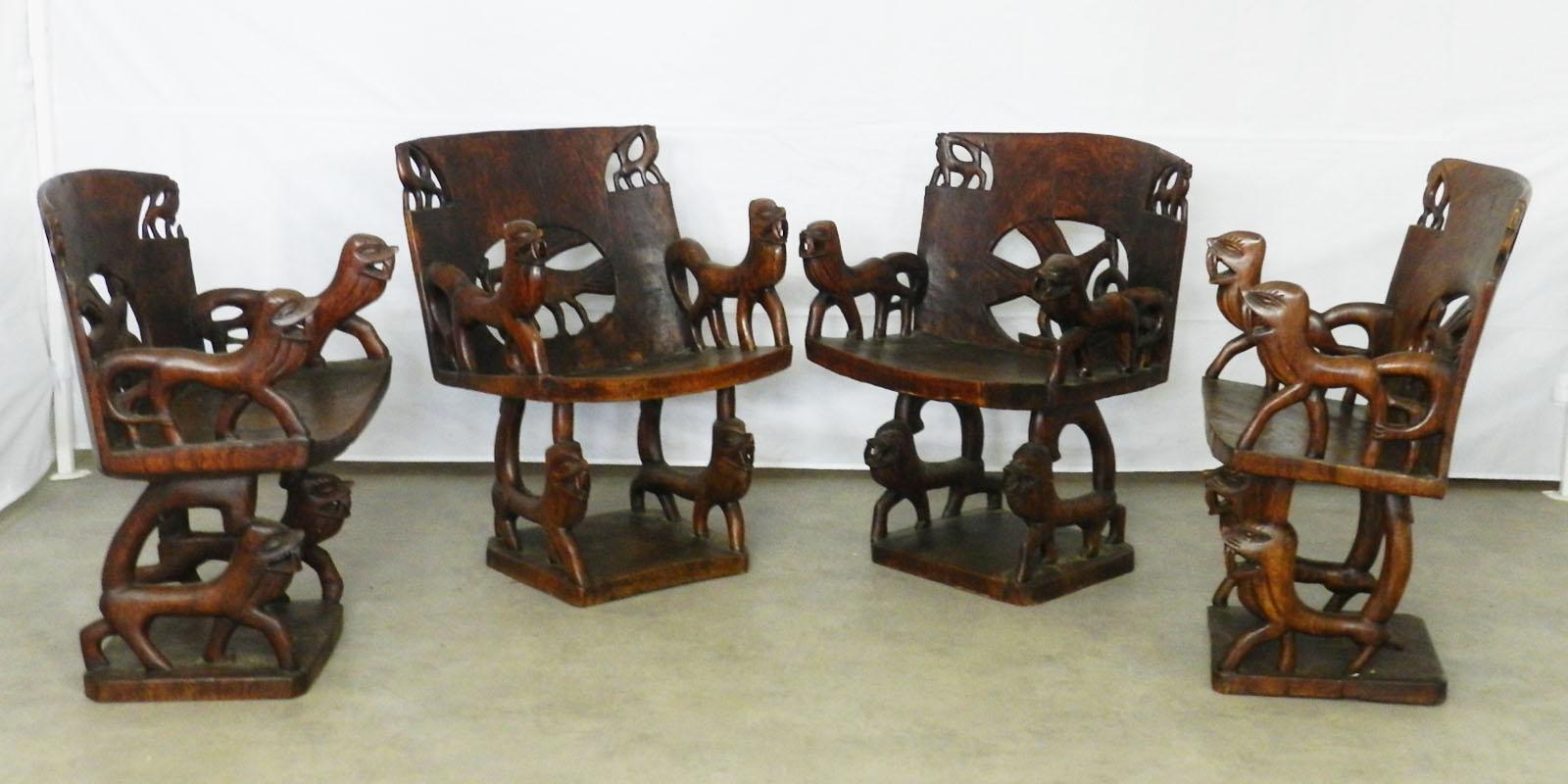 Two Pairs of African Chairs Carved Animals Wood Armchairs Early 20th Century In Good Condition In Labrit, Landes