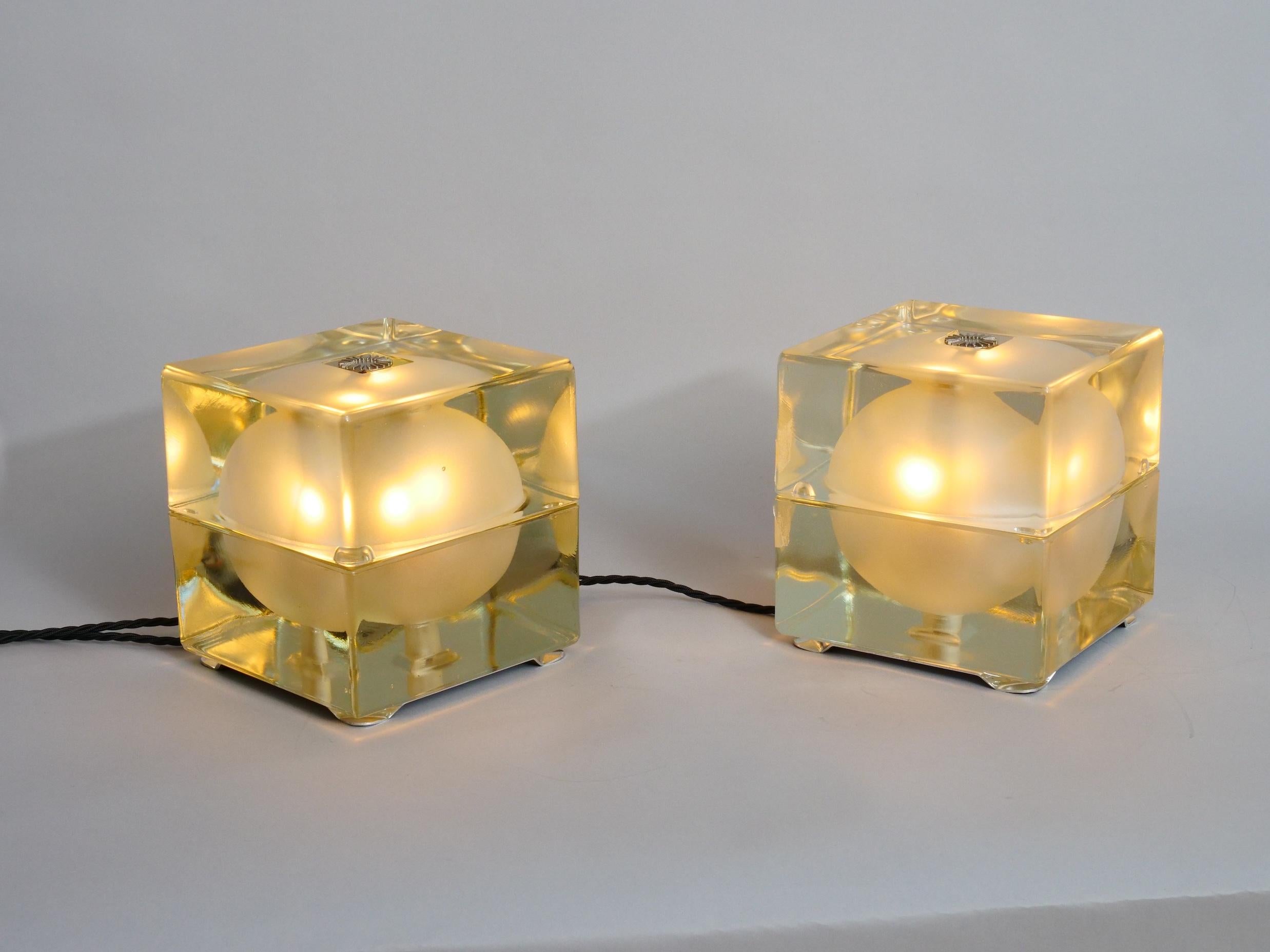 Two pairs of Alessandro Mendini 'Cubosferra' table lights. 

In excellent condition. No chips, cracks or scratches...

