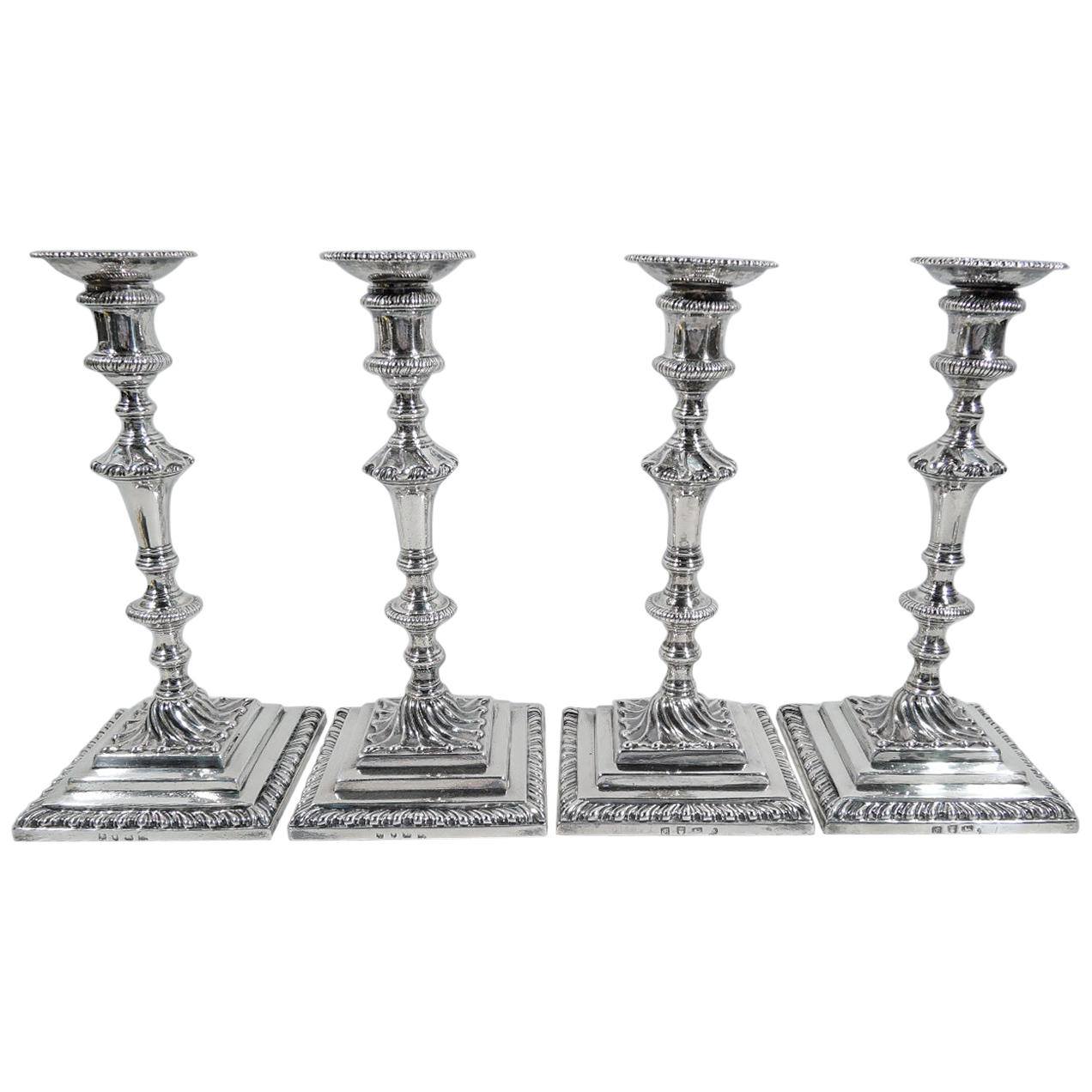 Two Pairs of English Georgian Sterling Silver Candlesticks