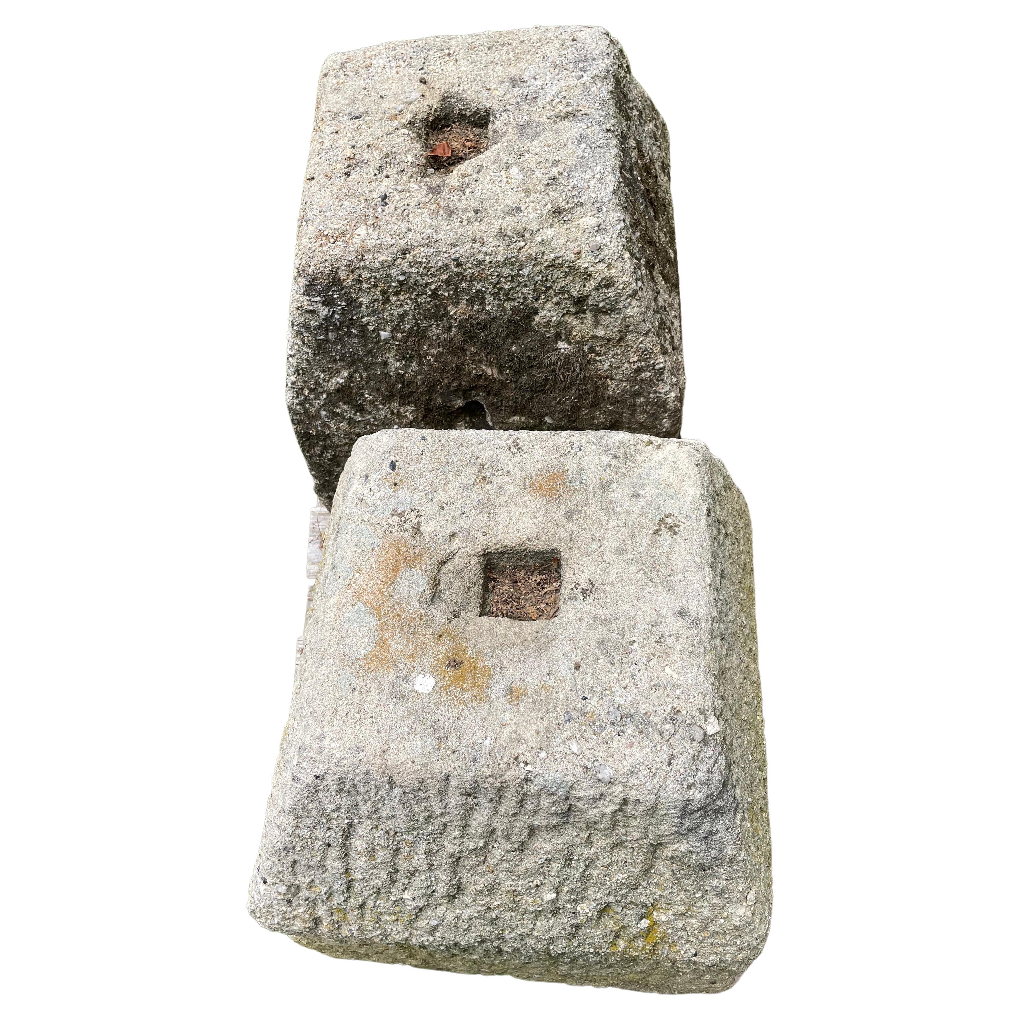 These hand-hewn stone plinths likely were original foundation stones and bear a resemblance to staddlestone bases, but are shorter and more stout.  Carved from a very hard heavily-fossilized stone, one pair measures 17