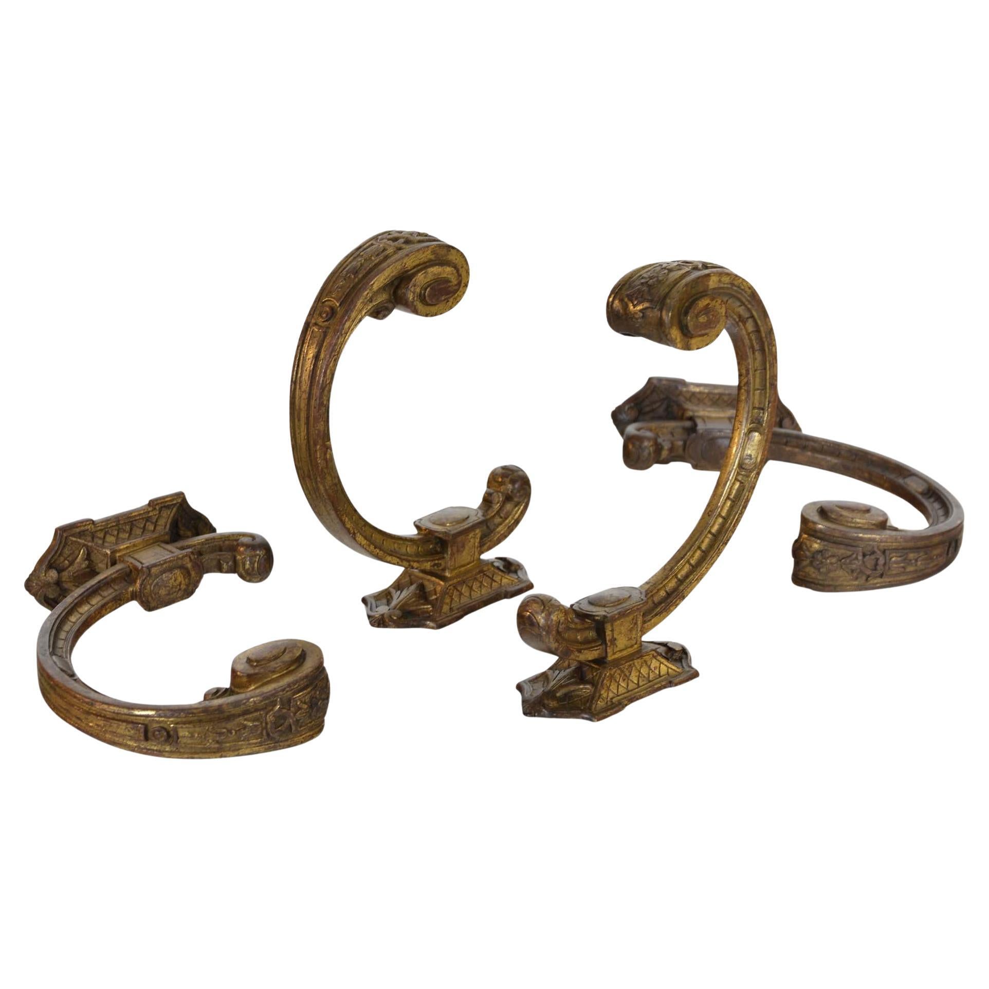 Two pairs of French antique 19th century ormolu curtain tie backs