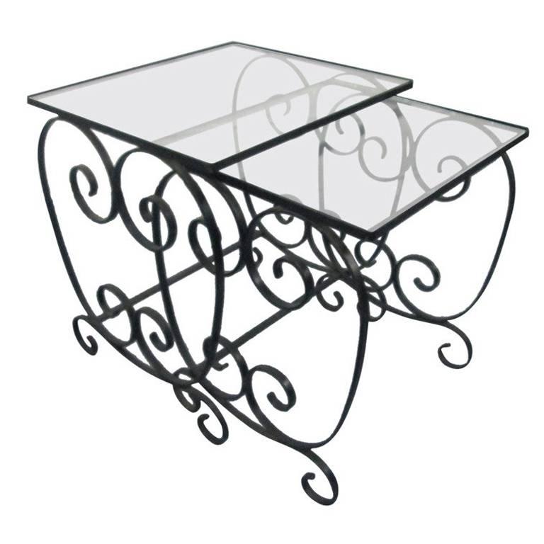 Two pairs of French, wrought iron nest of tables with glass tops.
Good for in or outdoors. Nice for a patio.
Larger table measures: 18.5 W x 16.5 D x 20 H.