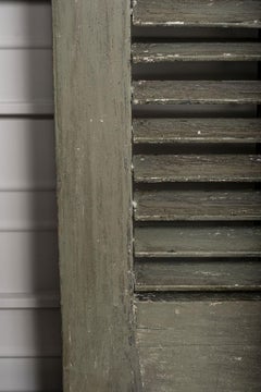 Two Pairs of Green-Painted Arched Shutters