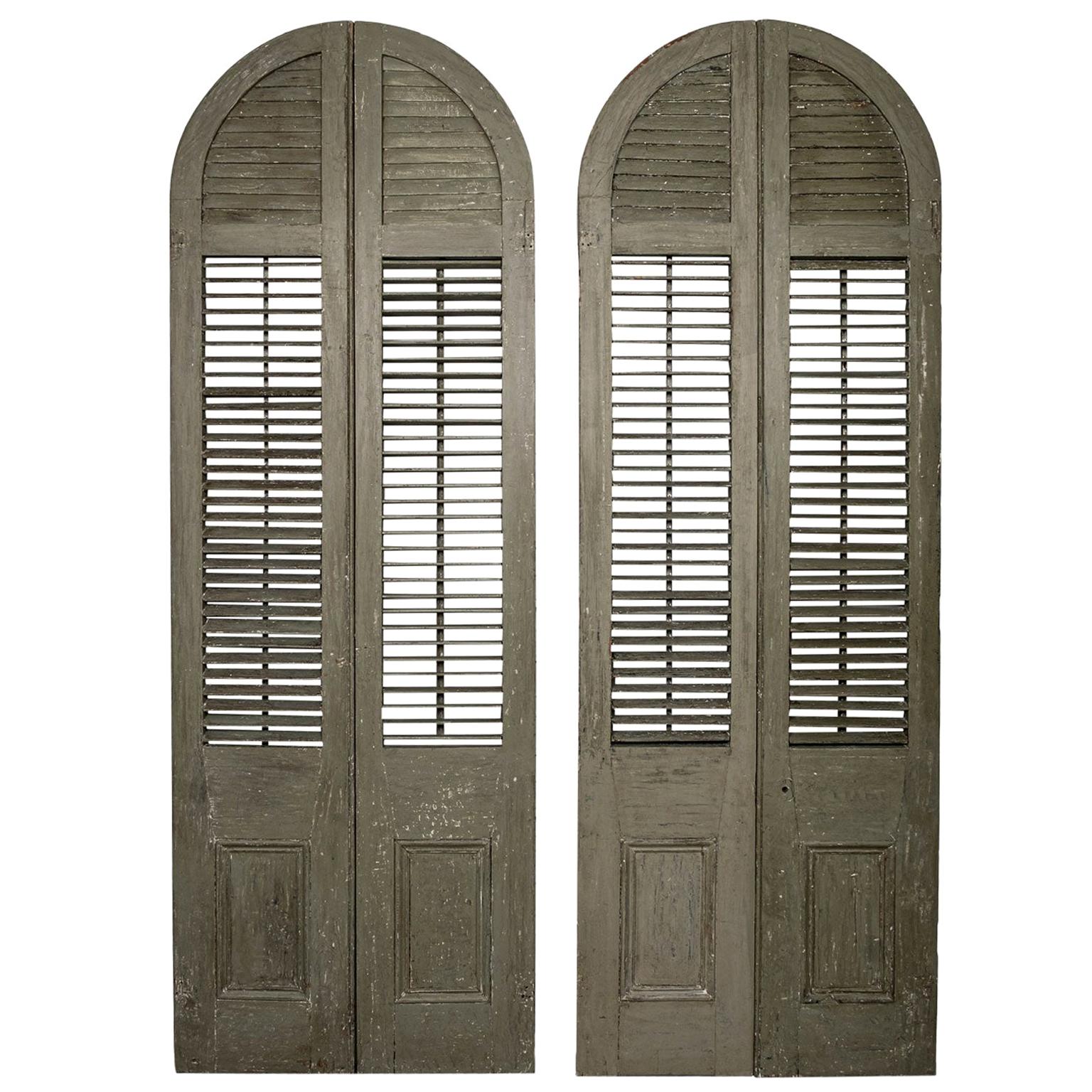 Two Pairs of Green-Painted Arched Shutters