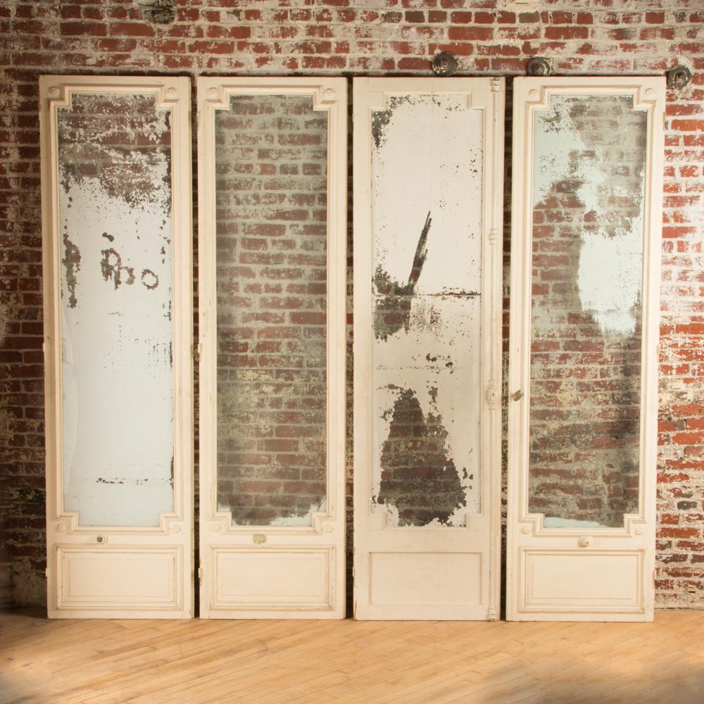 Two pairs of painted French doors, circa 1900.