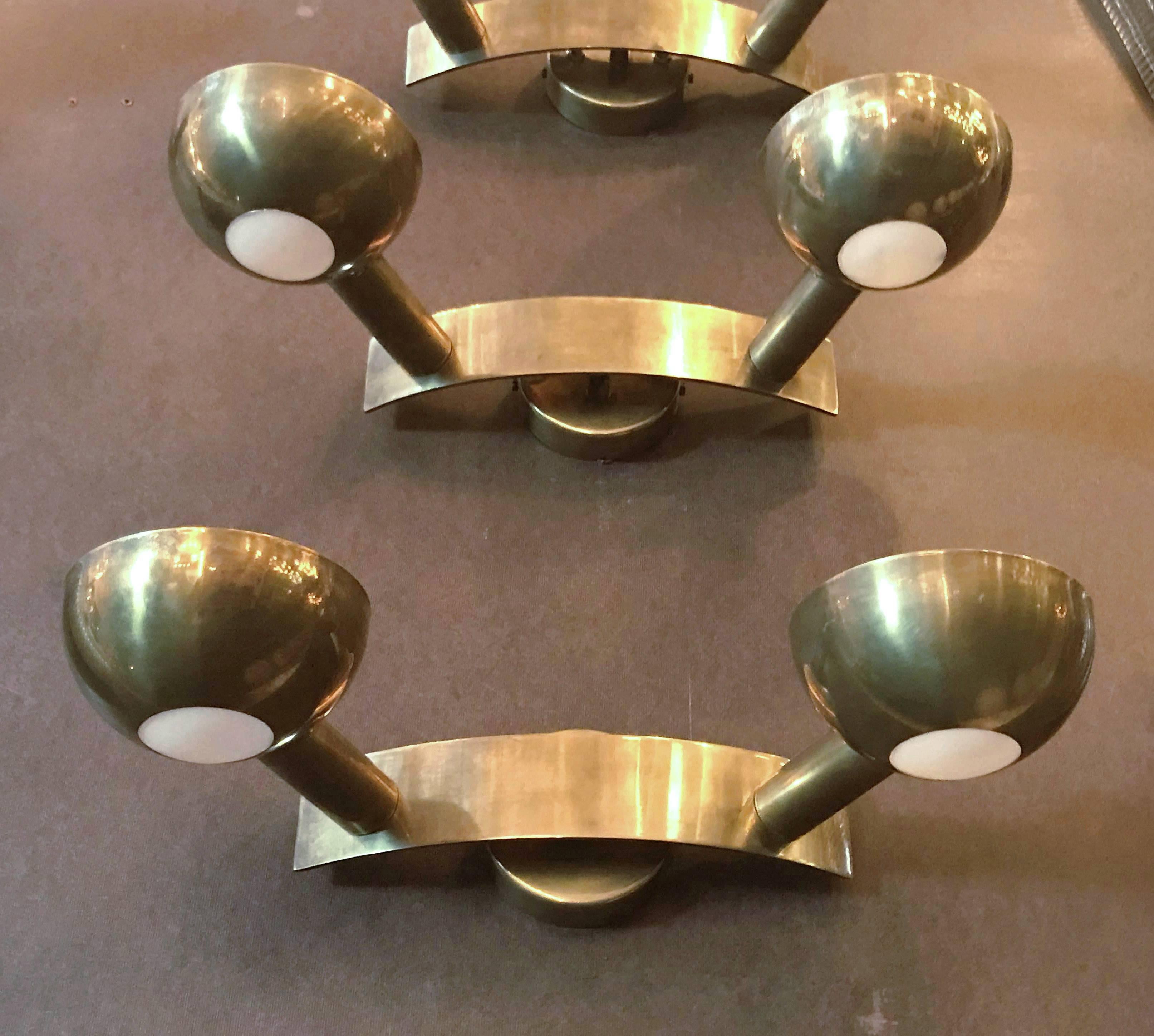 Rare vintage wall lights in iconic Minimalist design, polished brass and frosted glass lenses / Style of Stilnovo, circa 1954 / Made in Italy
2 lights / original E14 type / max 40W each
Measures: Width 16 inches / height 4 inches / depth 8