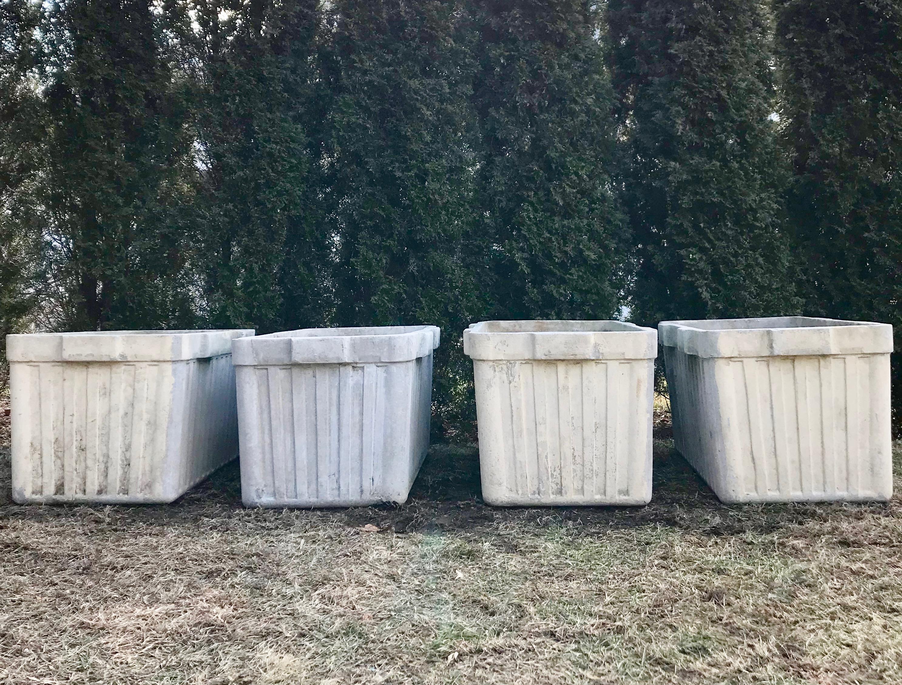 These very large rectangular ribbed planters with integral handles on two sides were designed by the iconic Willy Guhl and produced by Eternit of Switzerland. In very good structural condition with minor crazing to some of the top edges, they