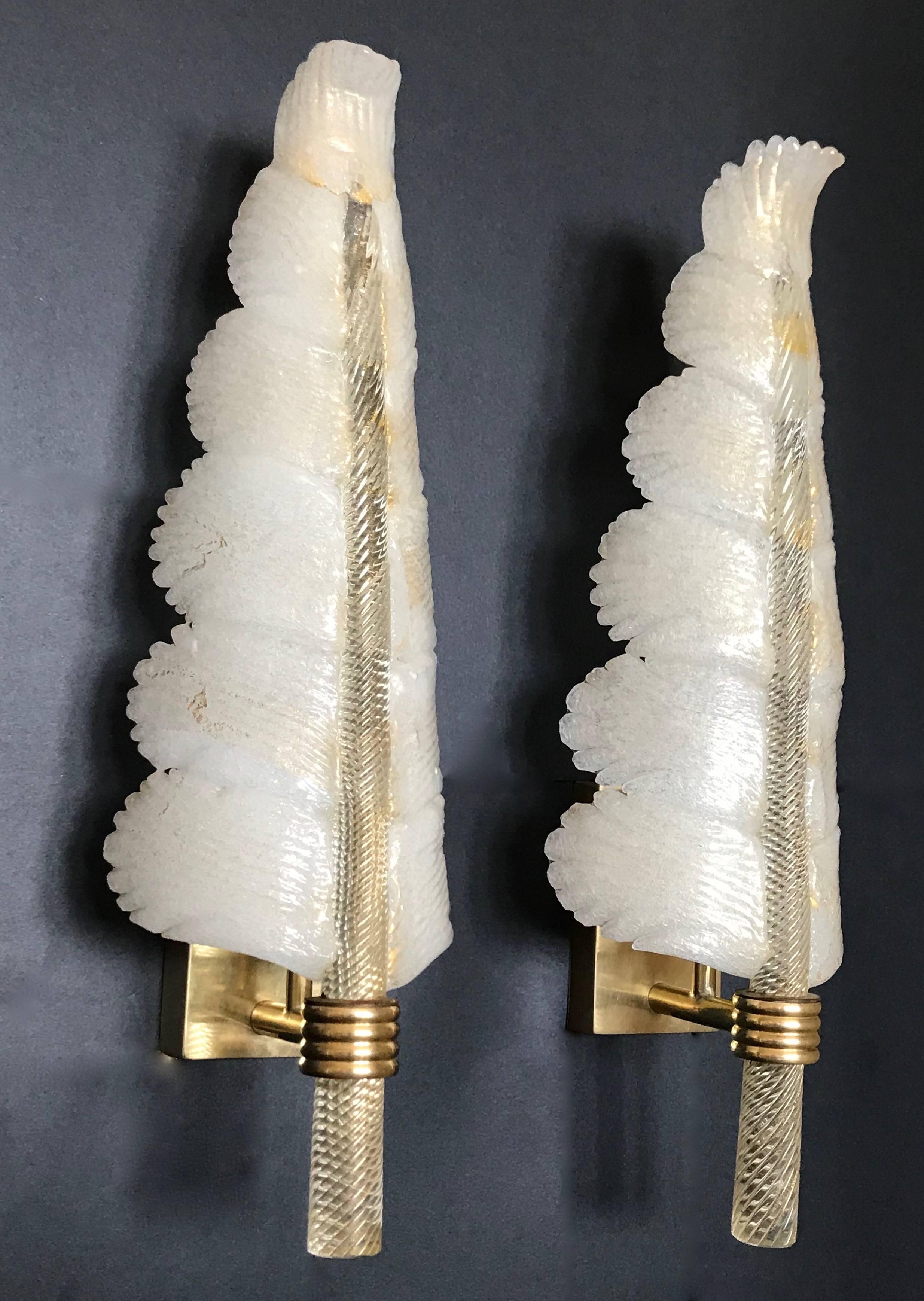 Beautiful set of four Murano Italian glass wall sconces in plume or feather form by Barovier et Toso. Centre stems are thick clear twisted glass infused with gold flecking. Puleguso glass sides (infused with tiny bubbles that create an opaque