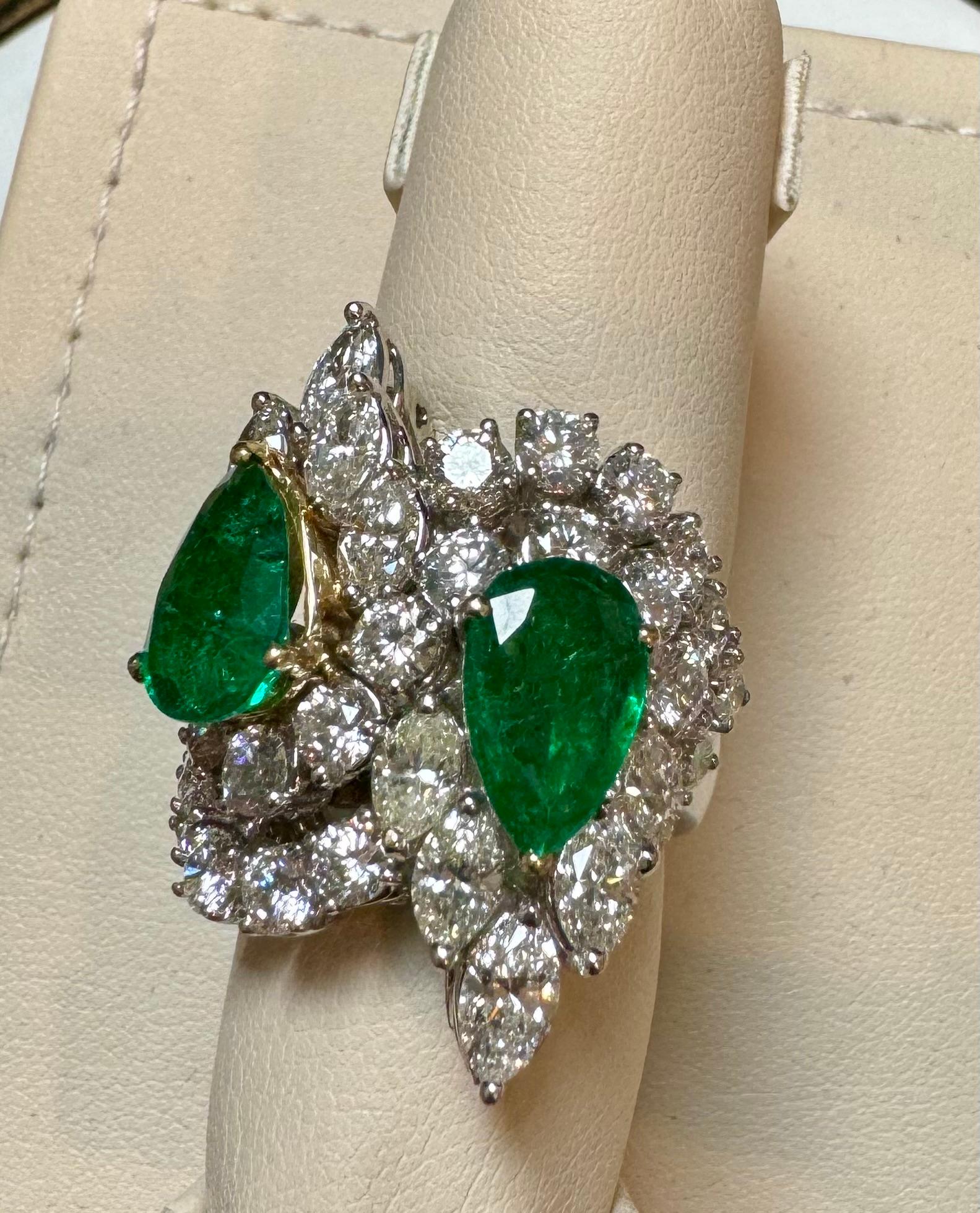 Introducing our exquisite 18 Karat White Gold Ring featuring two stunning Pear shape natural Zambian Emerald and 8.75 carats of diamonds. This ring is truly remarkable, showcasing the beauty of the emerald and the brilliance of the