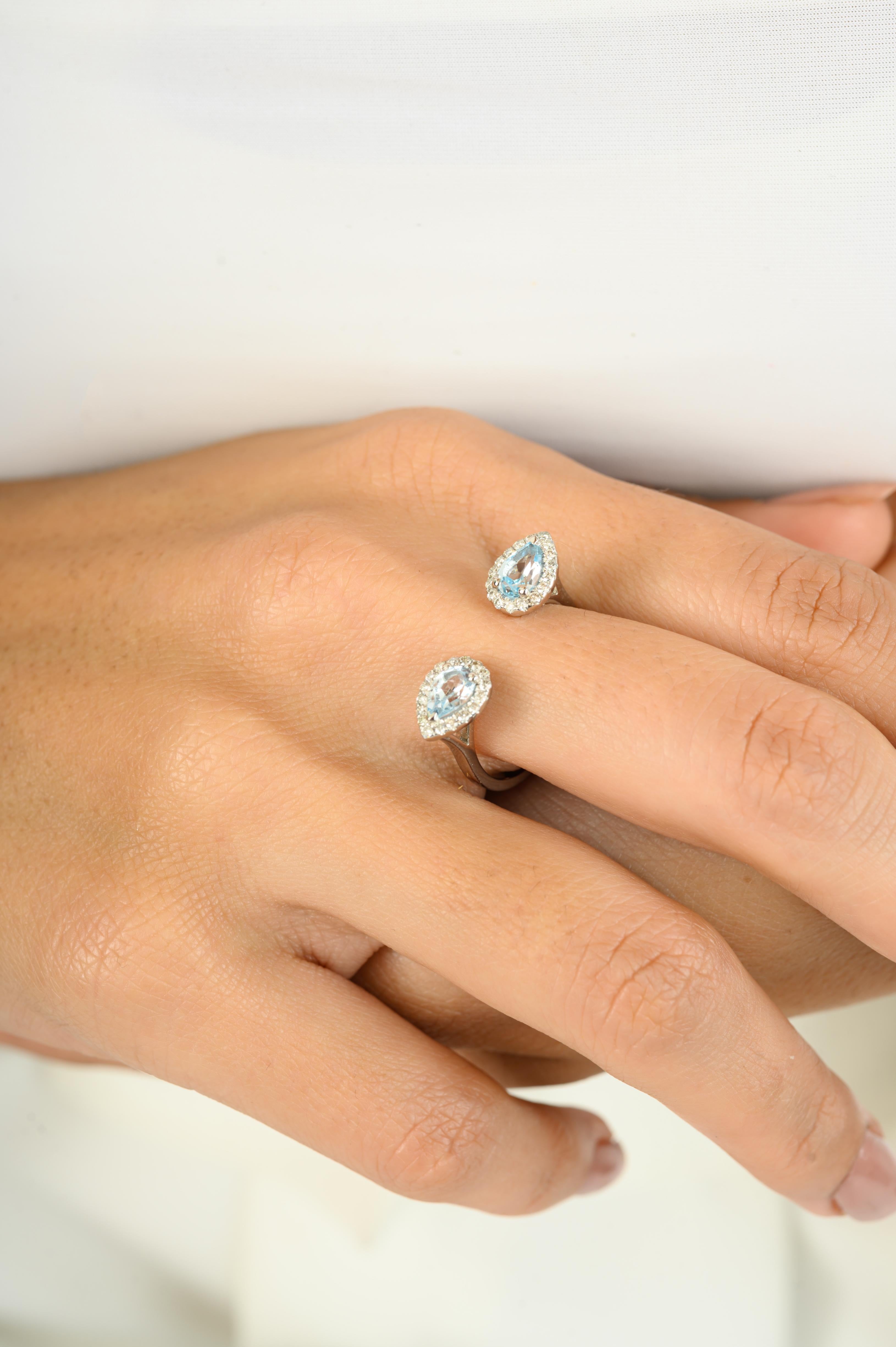 For Sale:  Two Pear Shaped Blue Topaz Halo Diamond Open Ring in 14 Karat Solid White Gold 7