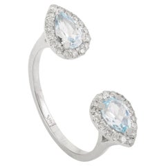 Offener Ring aus 14 Karat massivem Weißgold mit birnenförmigem blauem Topas und Halo-Diamant