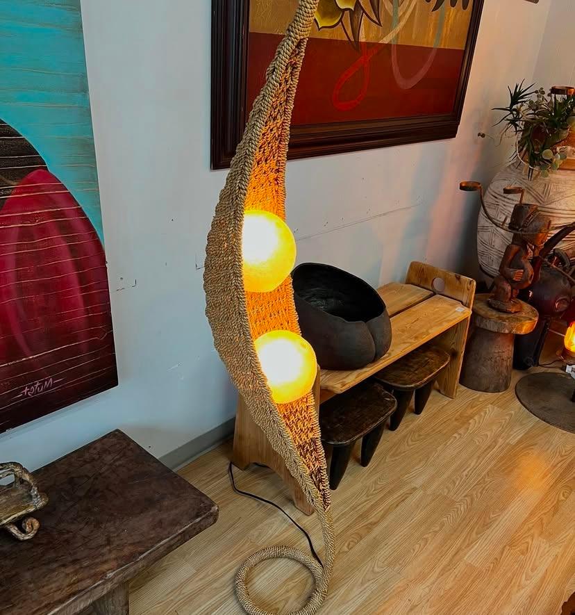 Two peas in a pod floor lamp features a woven rope base and hard plastic shell globes that are accessible through the bottom of each globe, Mexico, circa 1970s. U.S. plug-in and takes regular light bulb.

9