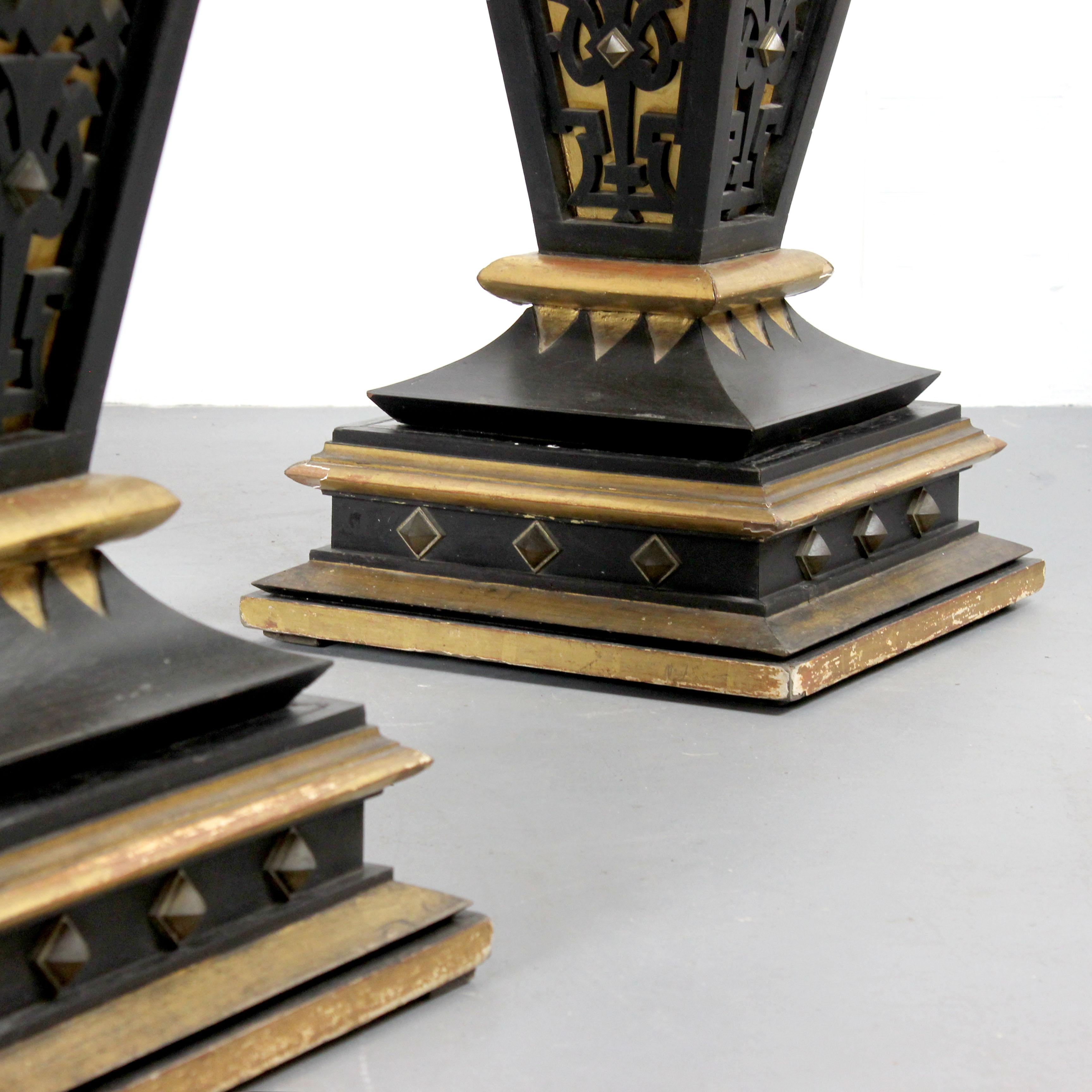 Bronze Two pedestals made of wood, gilded and painted black with details in gold bronze For Sale