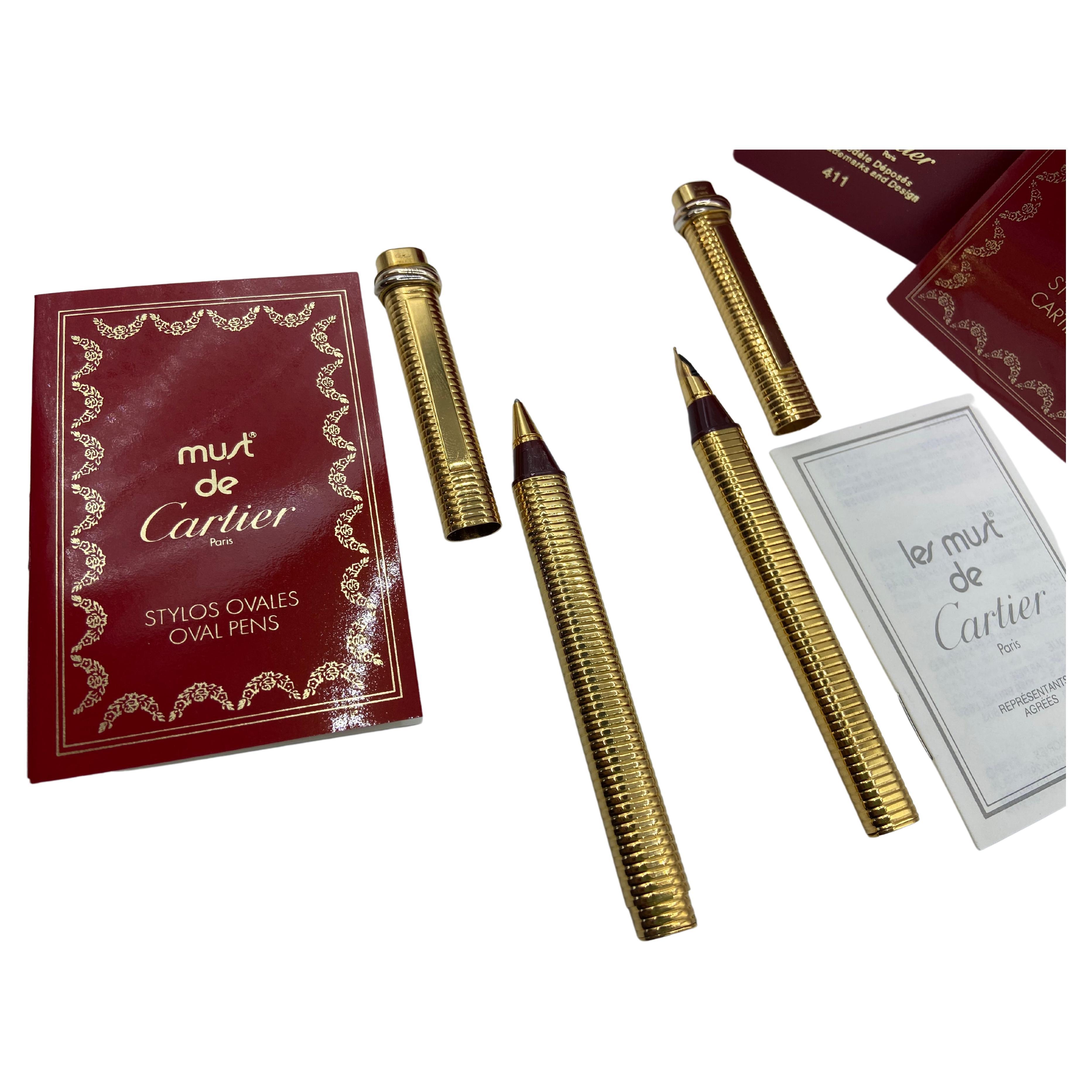 Two Pens, a Fountain Pen and a Roller, Santos by Must de Cartier, 18 Kt Gold Plated