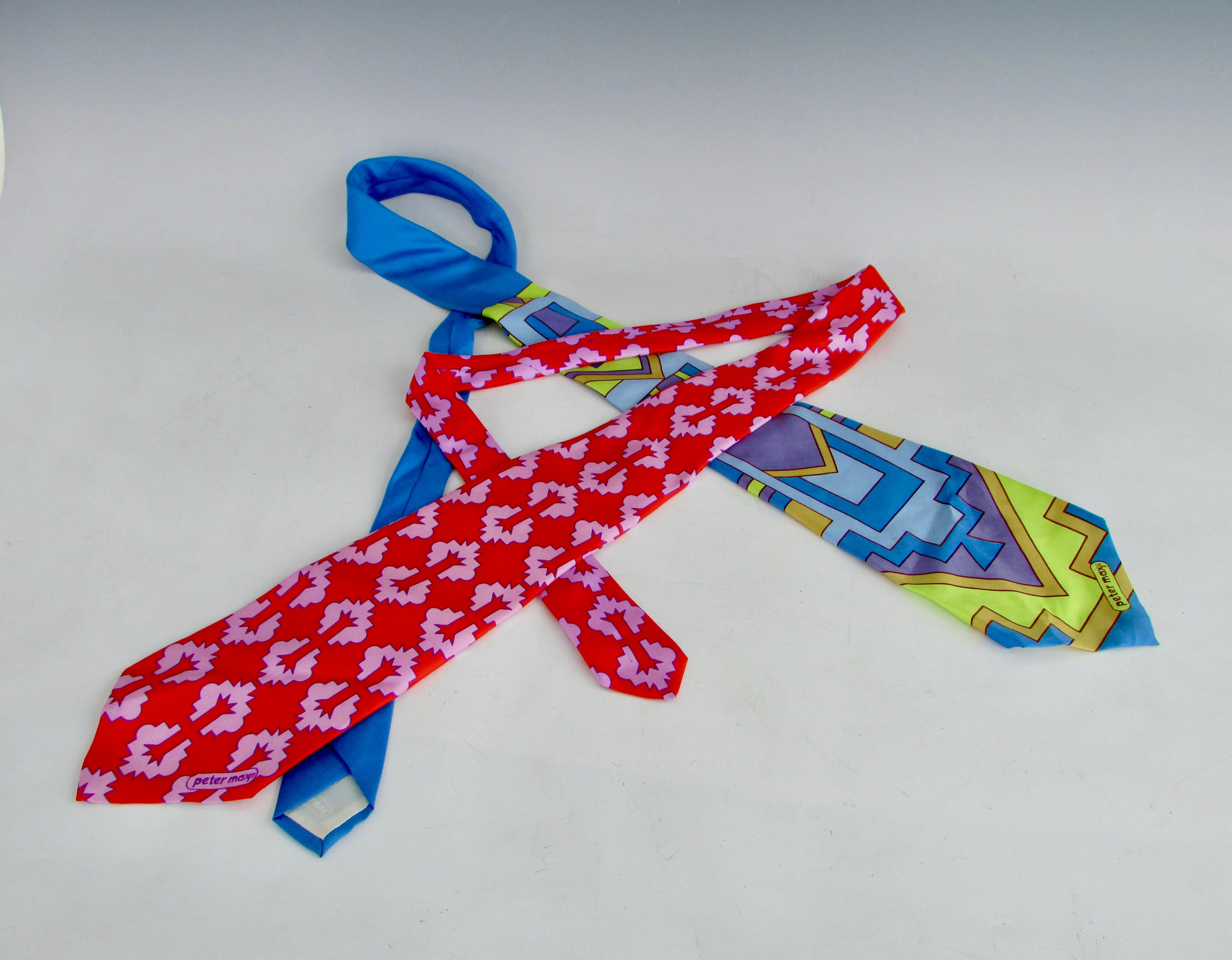 Two brightly colored ties in abstract design by Peter Max. On the wide side 4.75