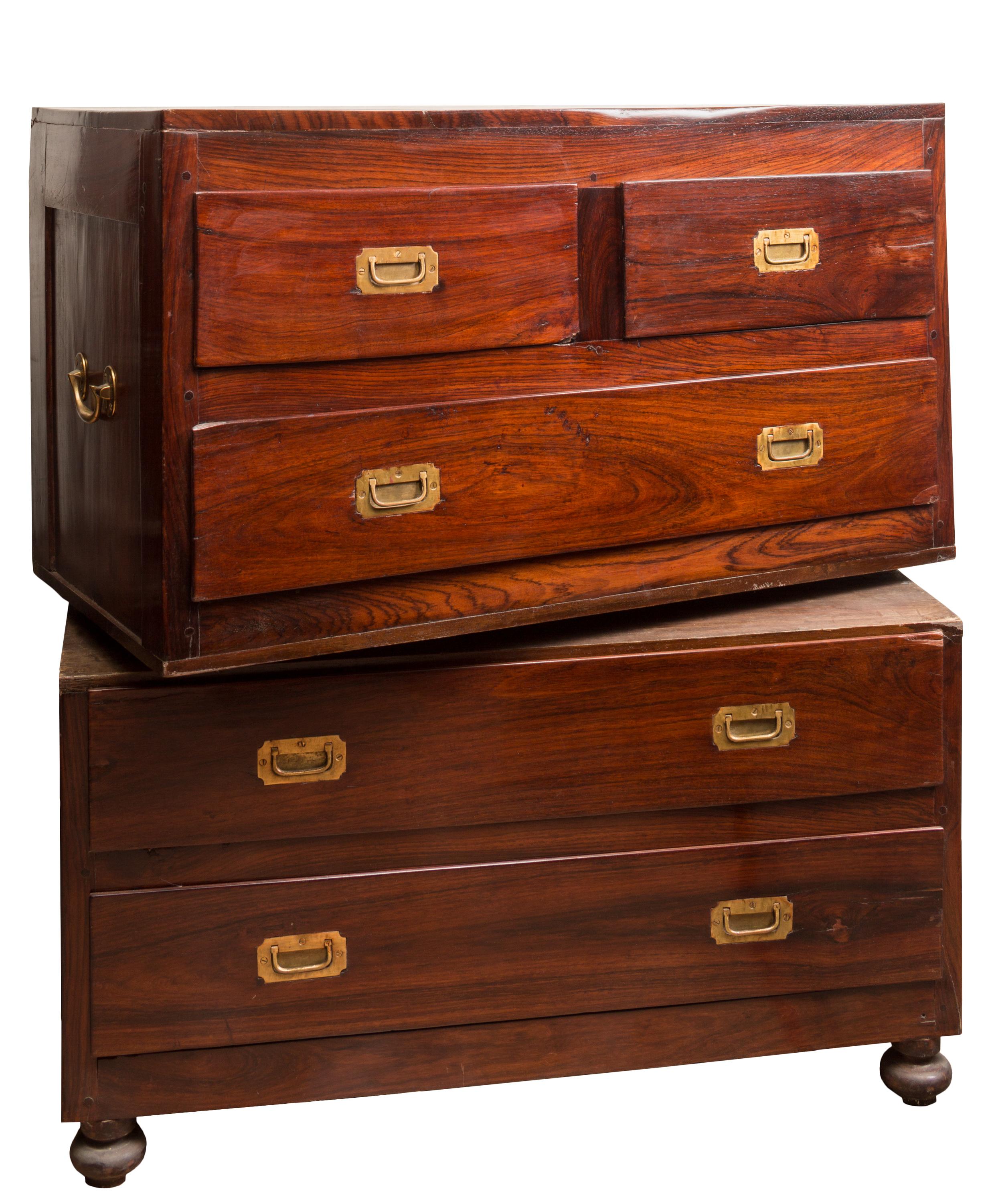 A 19th century British military Campaign two-piece chest of drawers, with original brass hardware. This particular style of furniture was originally developed to carry the belongings of officers during long military campaigns. It was built of