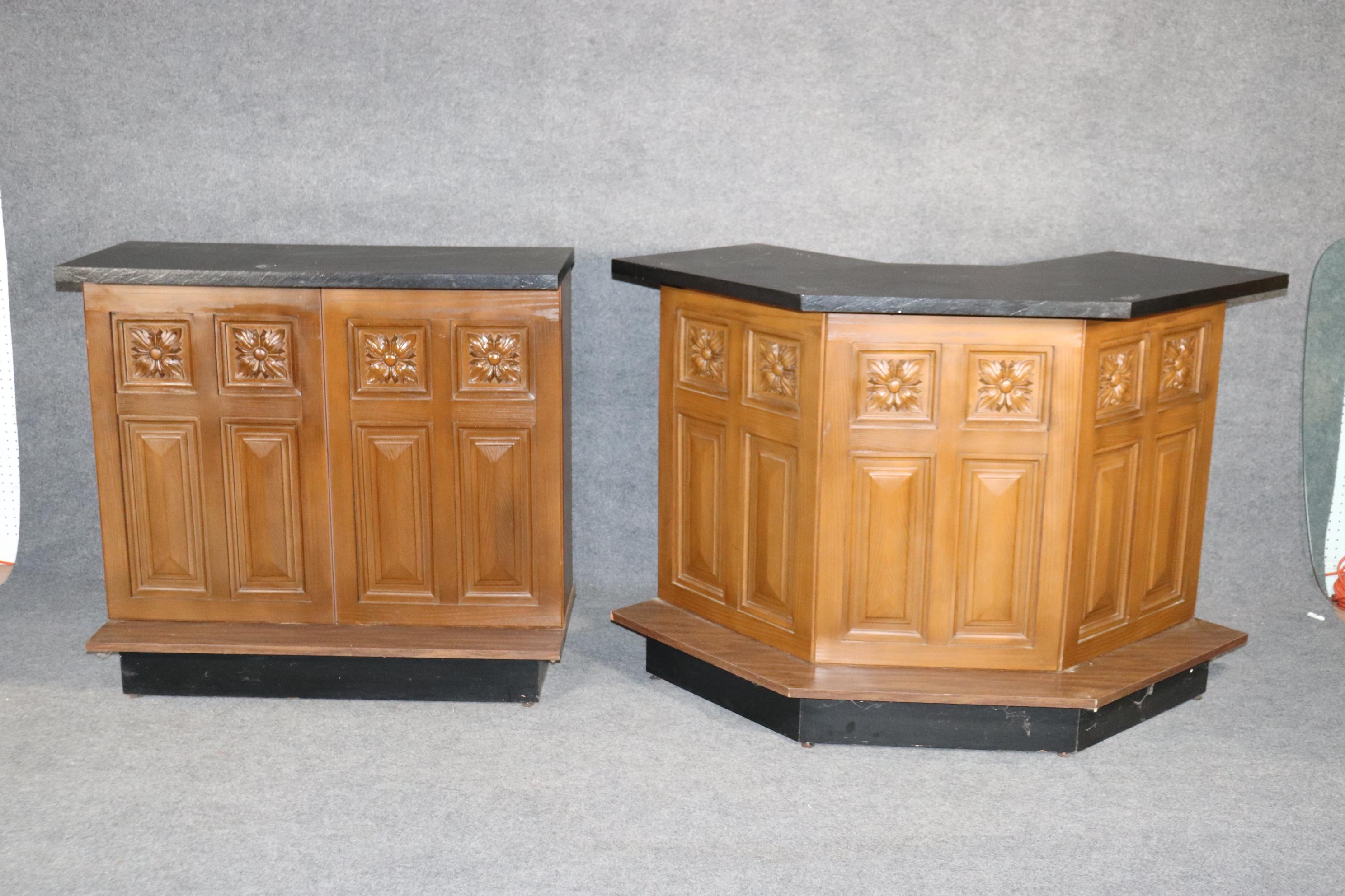 L-shaped bar made of two pieces with black faux slate top. Carved front, storage in back. 
Please confirm location NY or NJ.
